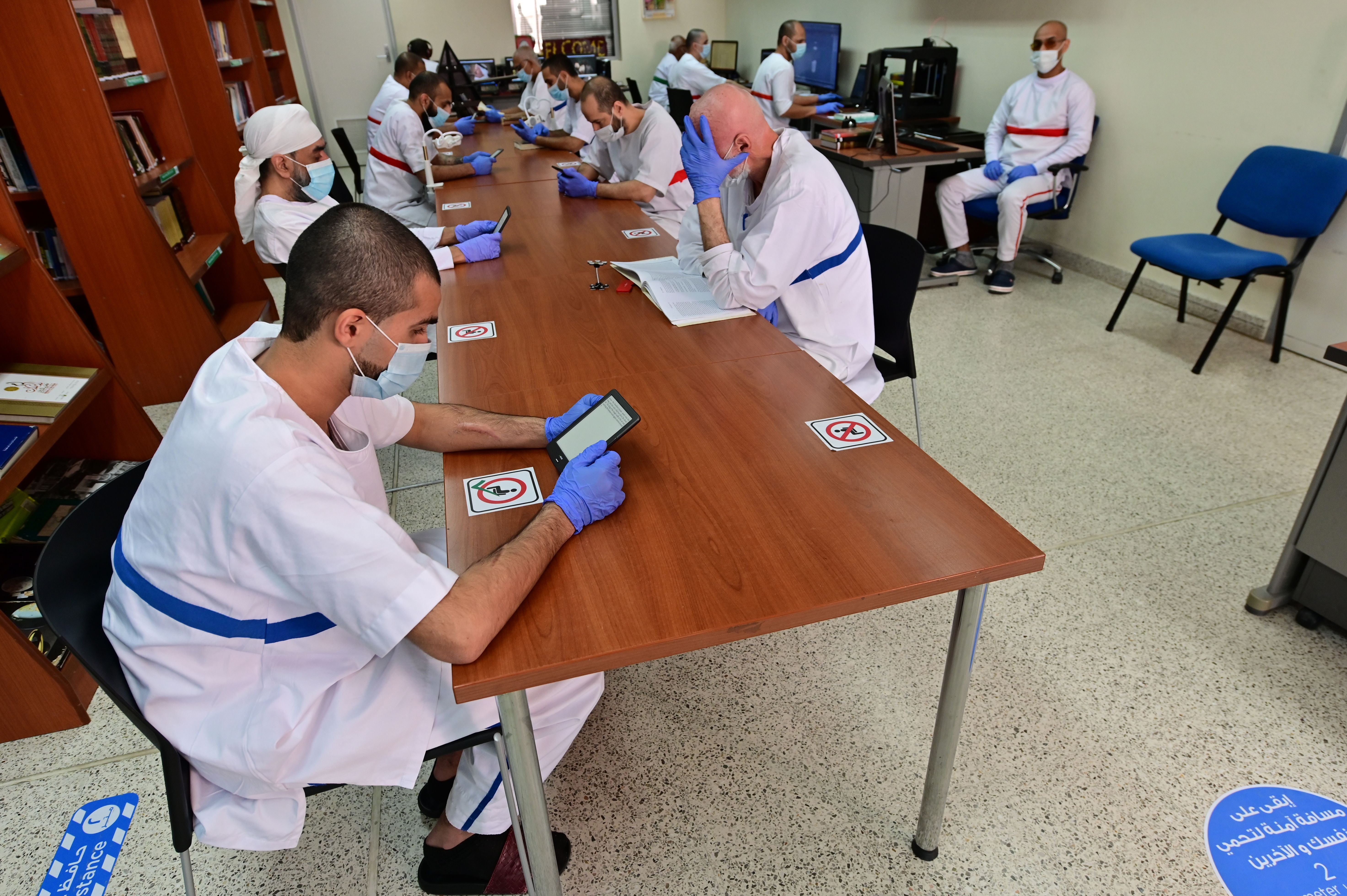 Inmates at the library of Dubai's Al-Awir central prison