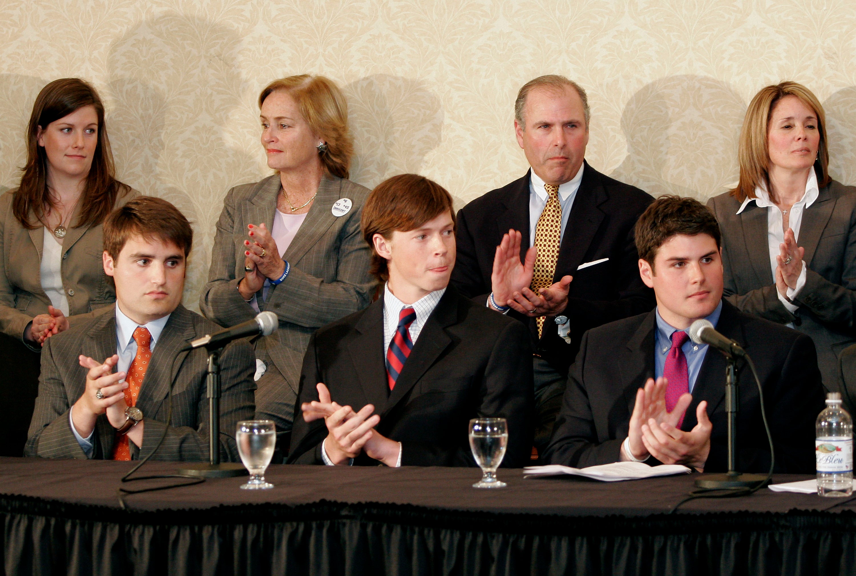 Seated from left, Duke lacrosse players David Evans, Colin Finnerty and Reade Seligman listen during a news conference at the Sheraton Raleigh Hotel after being cleared of sexual assault charges April 11, 2007 in Raleigh, North Carolina