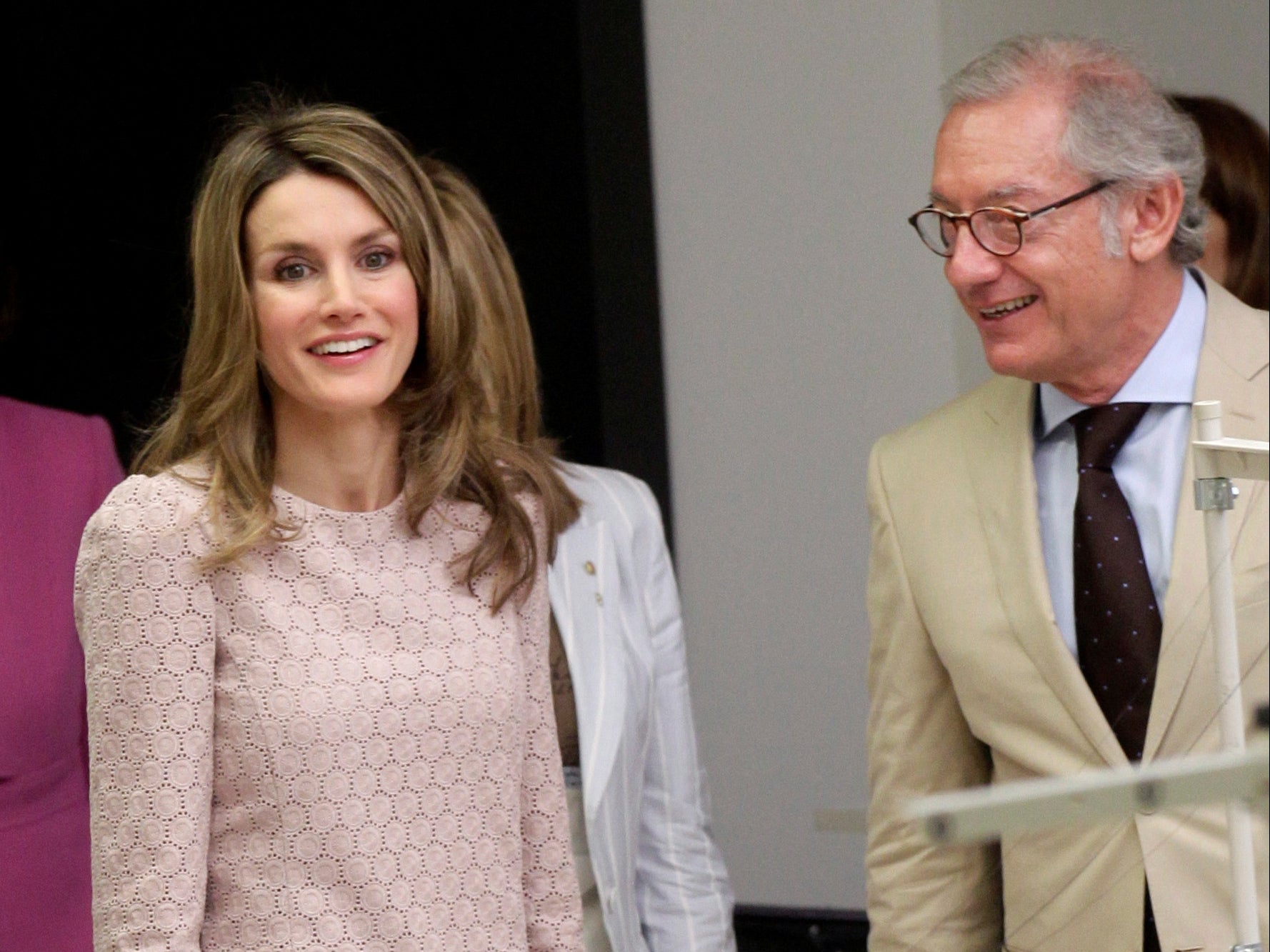 Isak Andic stands next to Spain’s Princess Letizia during a visit to a factory near Barcelona