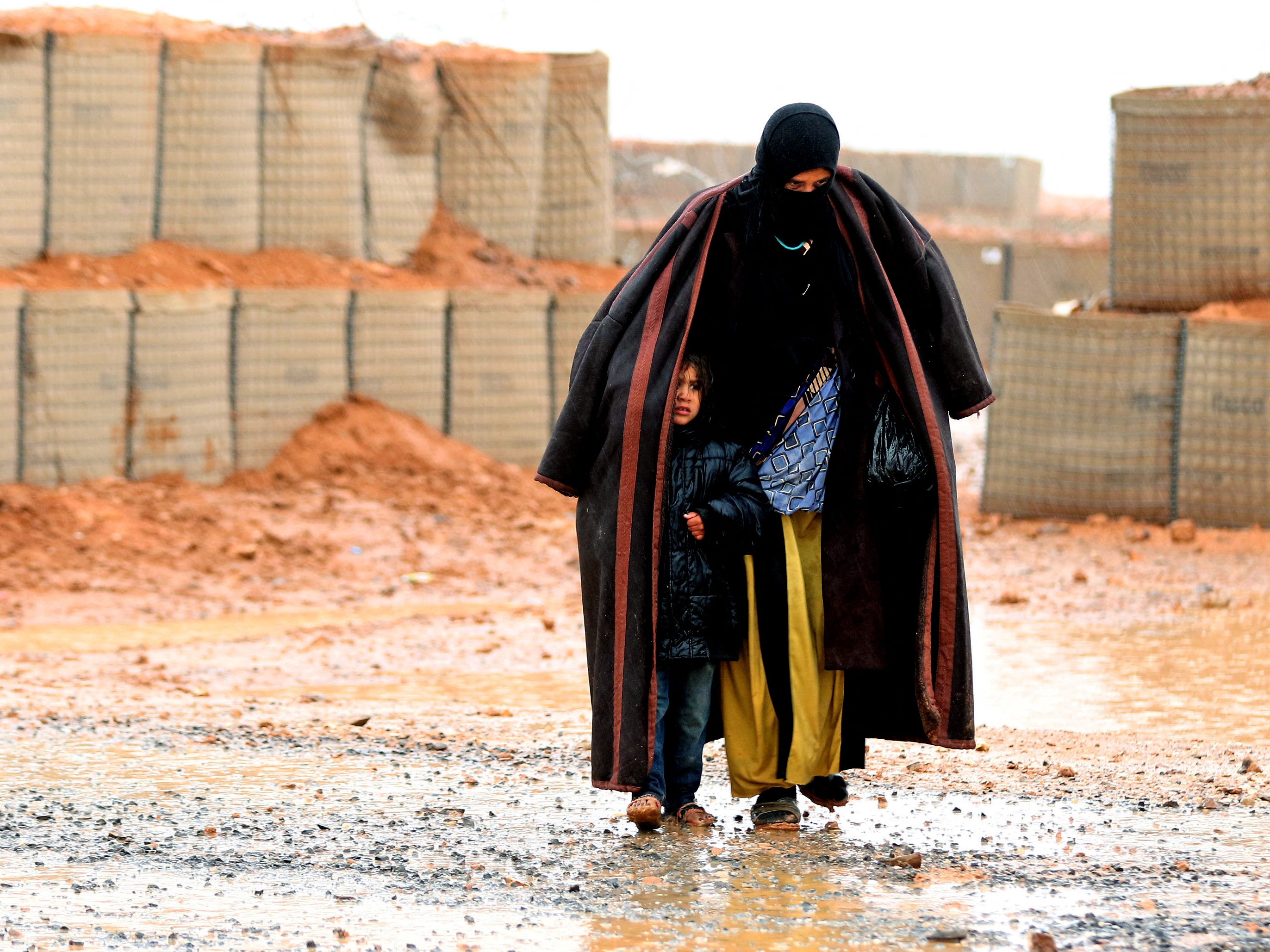 A Syrian woman with a child in the Rukban camp near the Jordanian border in 2017