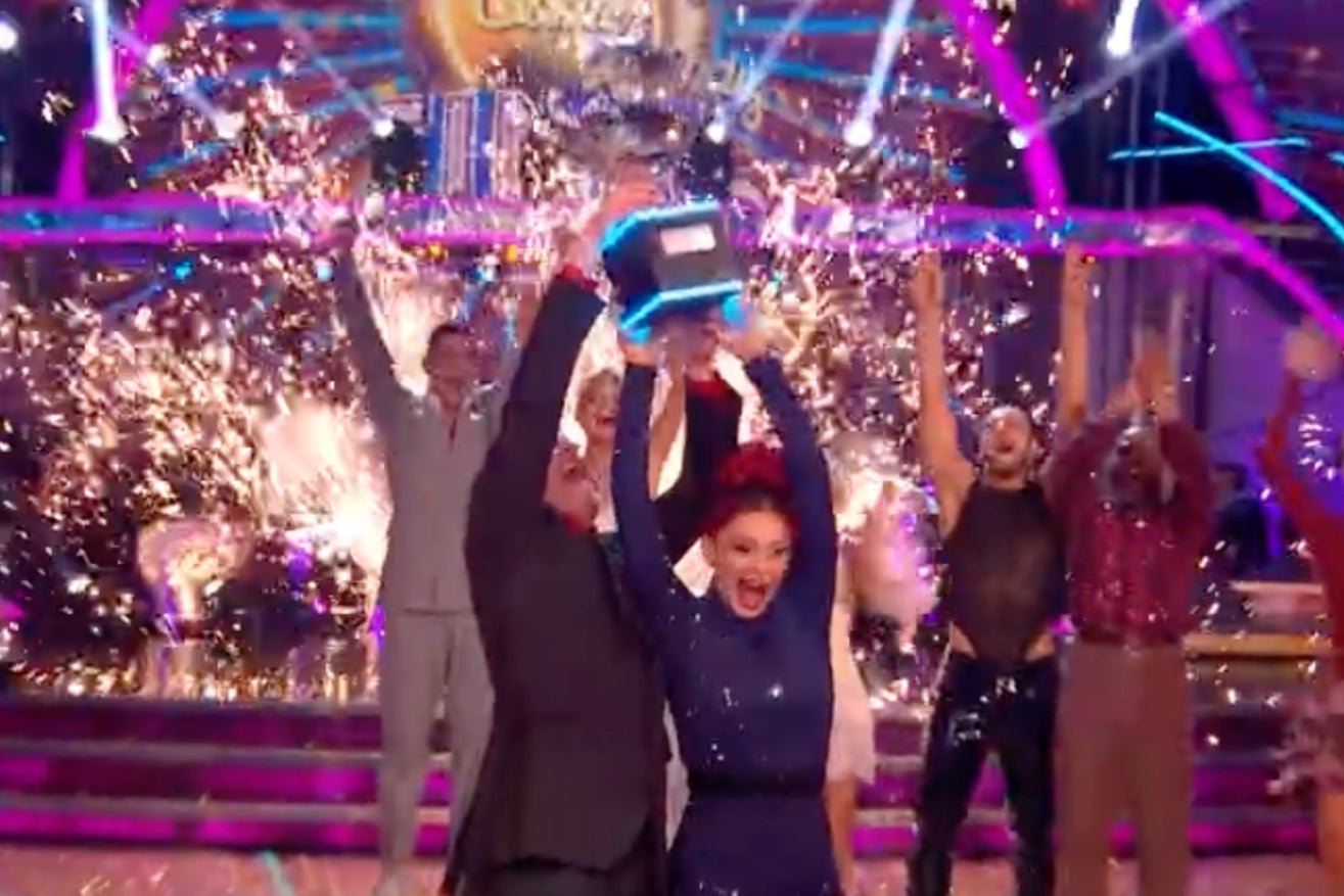 Chris and Dianne lift the glitterball trophy