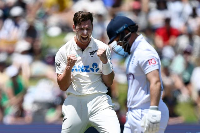 New Zealand bowler Matt Henry celebrates the wicket of England’s Ben Duckett, right, during play on day two of the third cricket test between England and New Zealand (Andrew Cornaga/Photosport via AP)