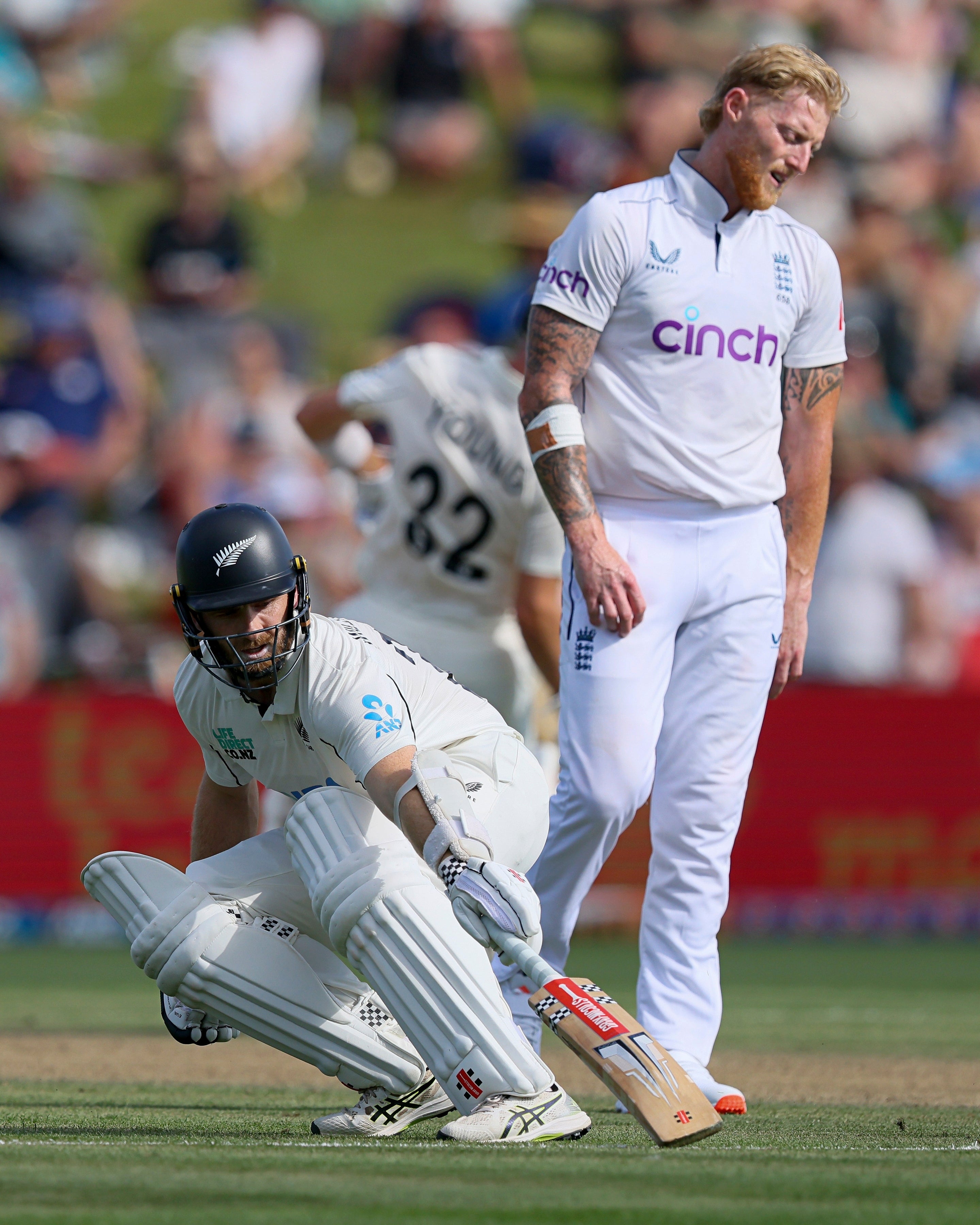 New Zealand batsman Kane Williamson, left, takes a run as England captain Ben Stokes reacts (Bruce Lim/Photosport via AP)