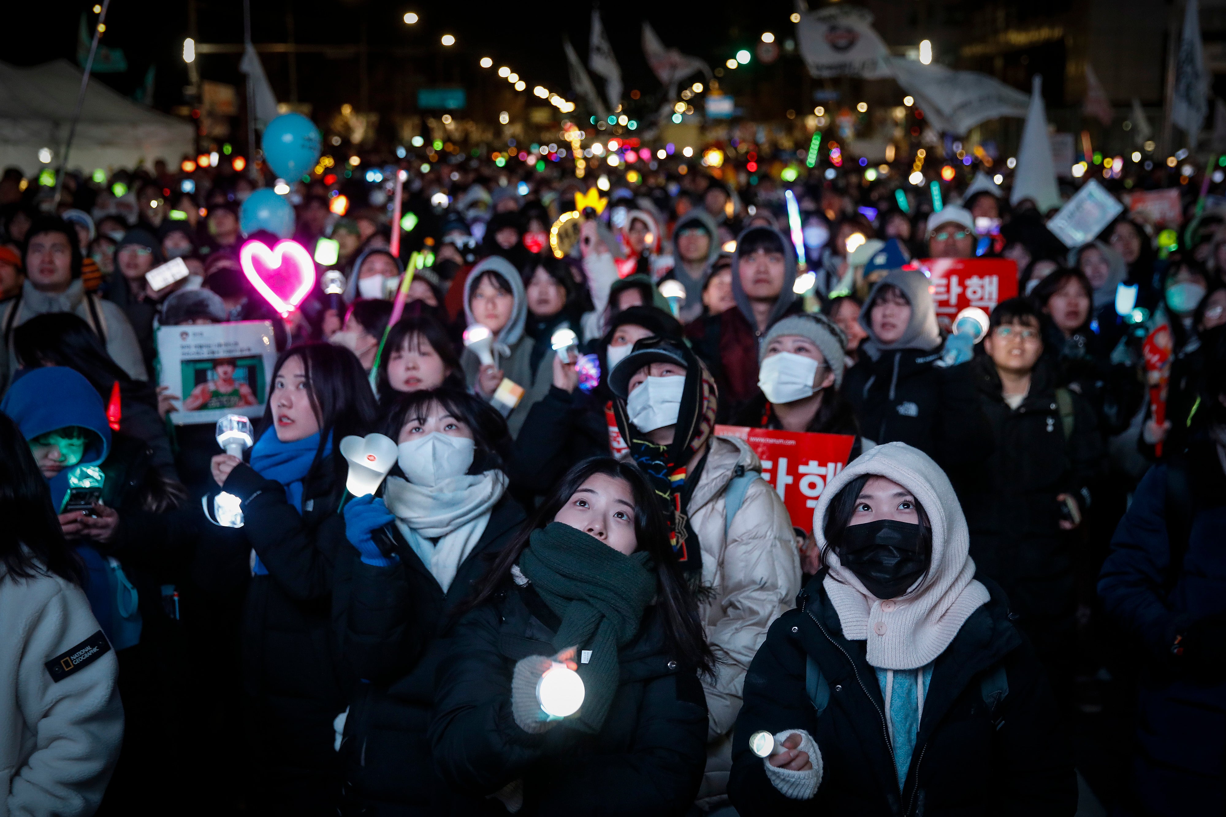 Protesters celebrate the impeachment of South Korea’s president Yoon Suk Yeol