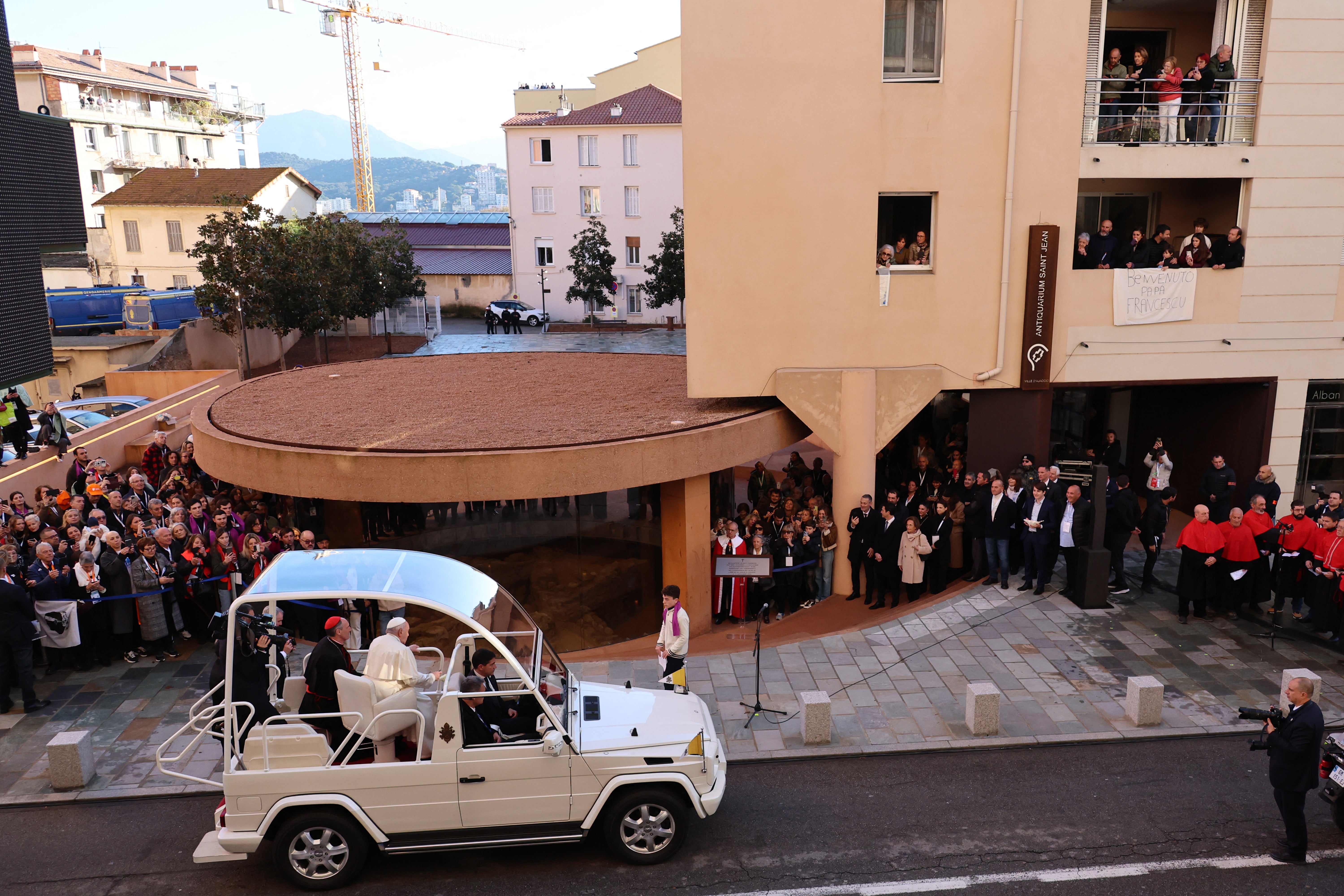 Pope Francis arrives in his Popemobile to visit the Paleochristian Baptistery of Saint-Jean in Ajaccio on his trip on the French island of Corsica