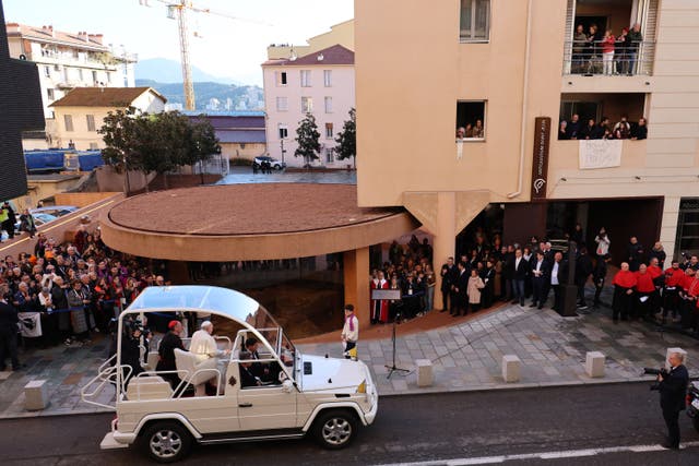 <p>Pope Francis arrives in his Popemobile to visit the Paleochristian Baptistery of Saint-Jean in Ajaccio on his trip on the French island of Corsica</p>