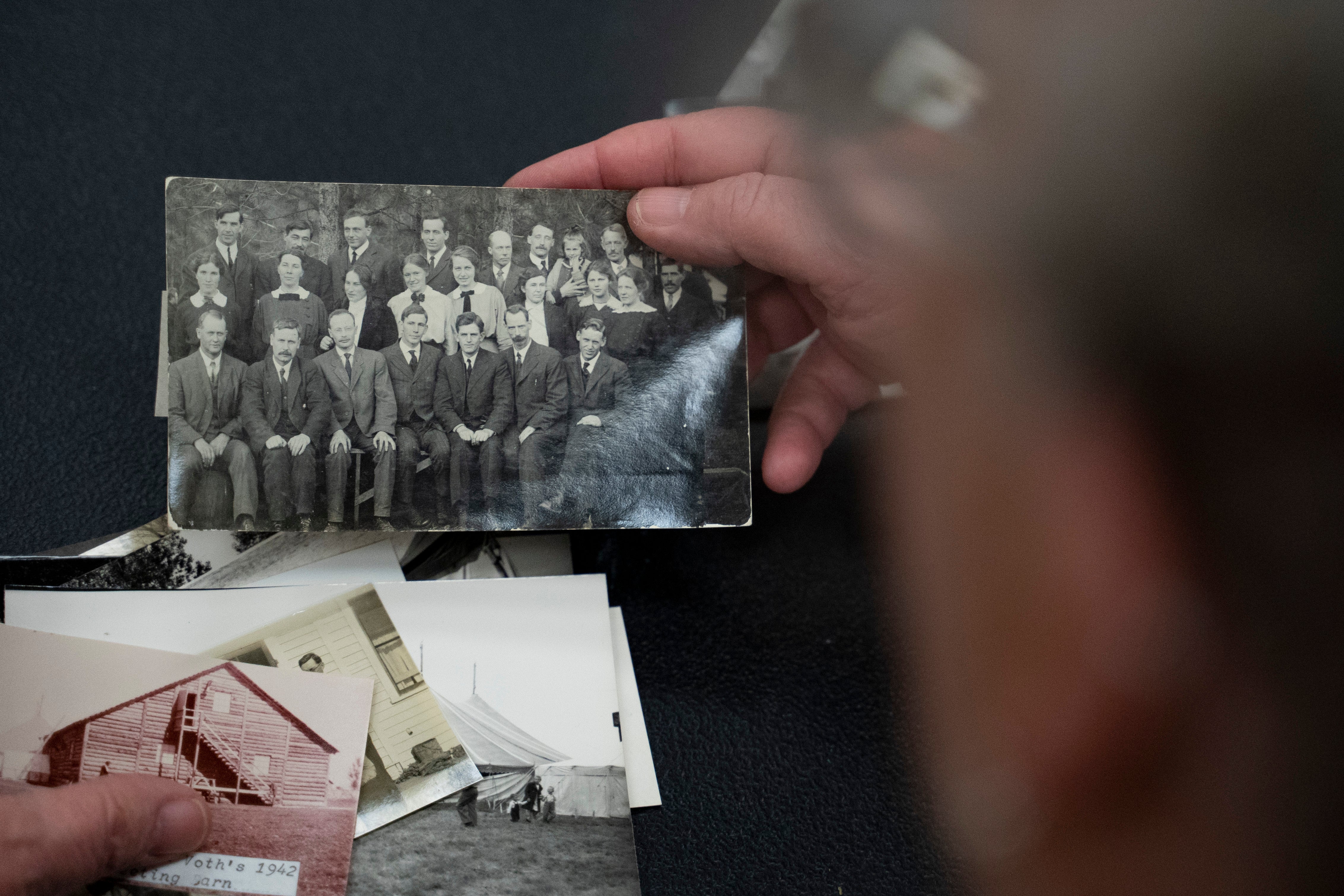 Pam Walton holds a photograph of ‘Two by Twos’ ministers, also referred to as ‘workers’