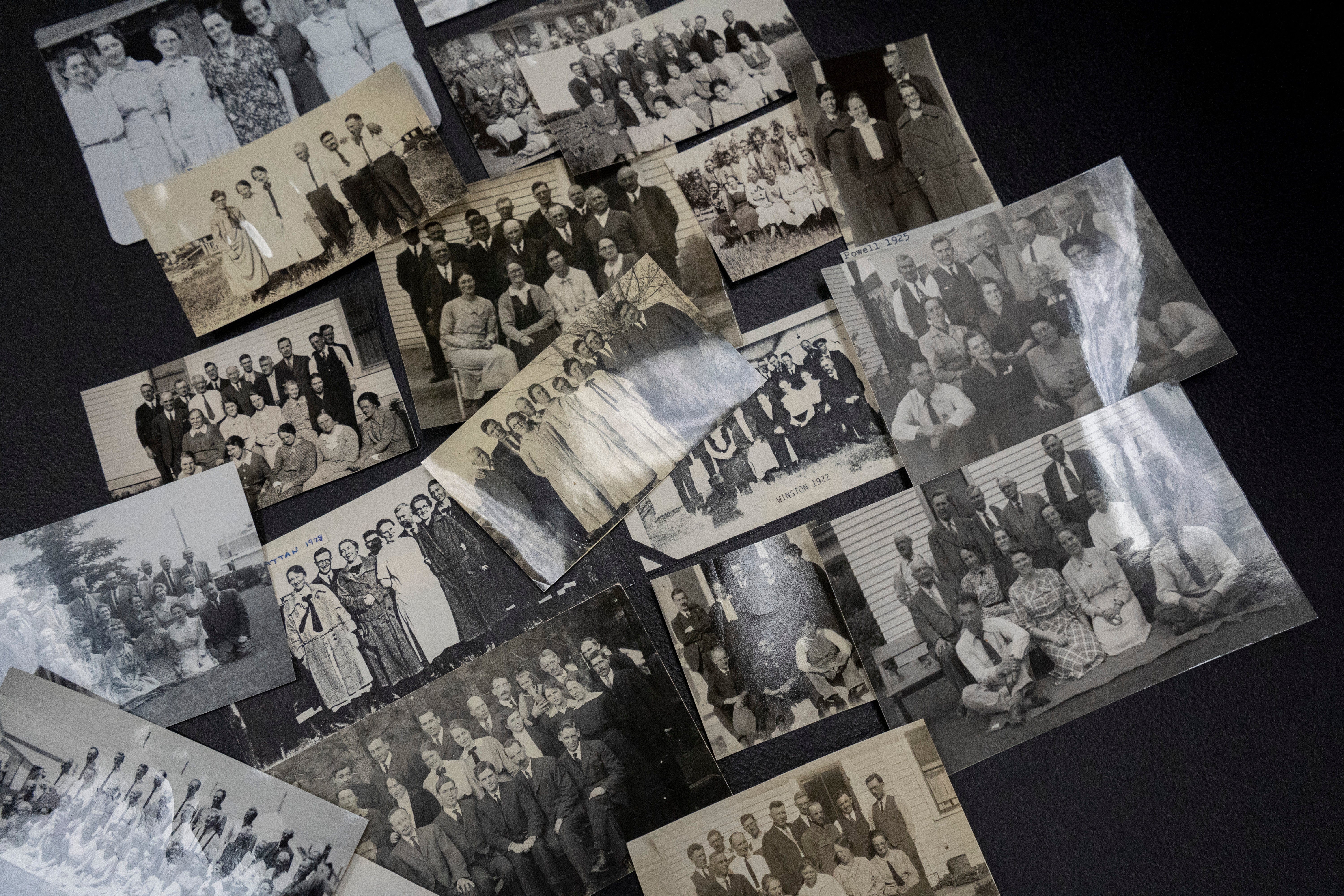 Photographs from annual ‘Two by Twos’ sect conventions sit on a table at a library