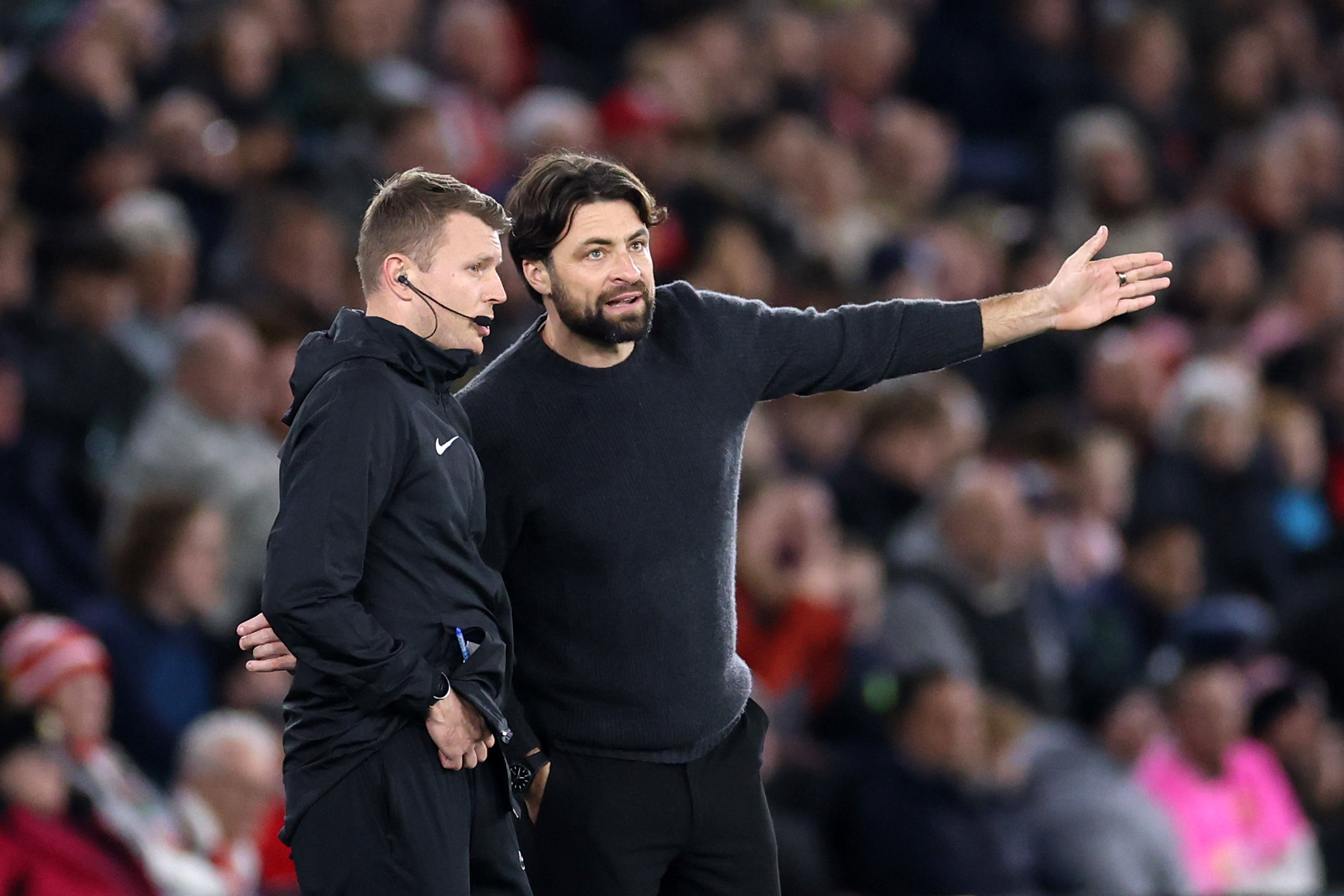 Russell Martin, Manager of Southampton, interacts with fourth official Sam Barrott