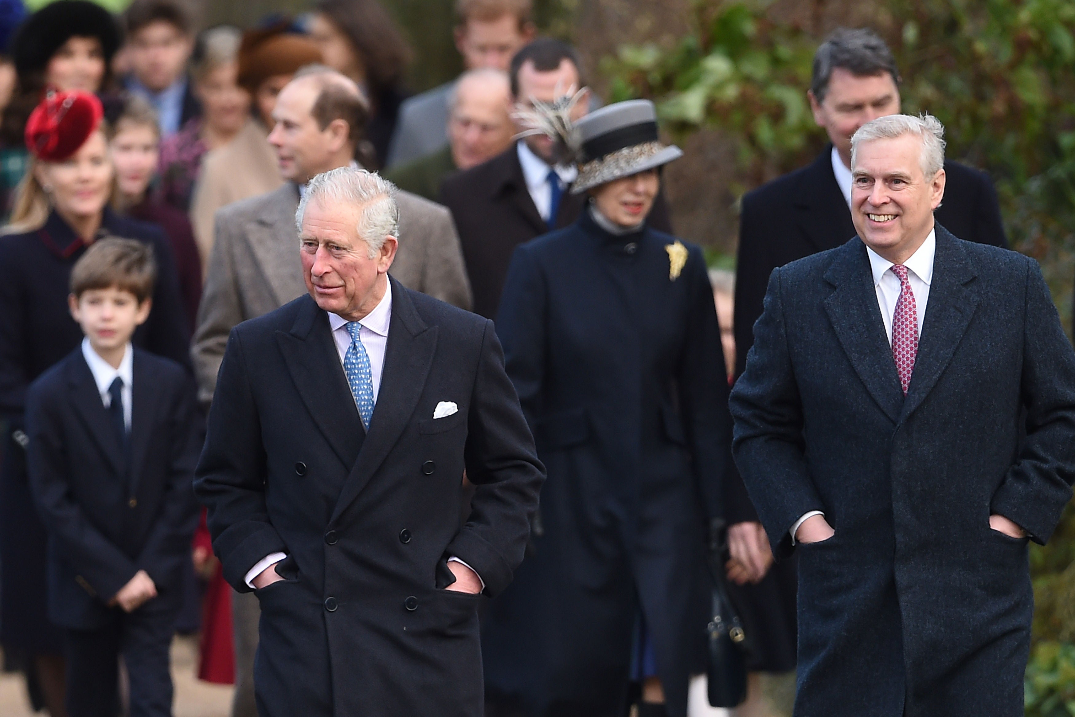 Andrew walks with his brother Charles at the head of the royal family on the way to Church on Christmas Day