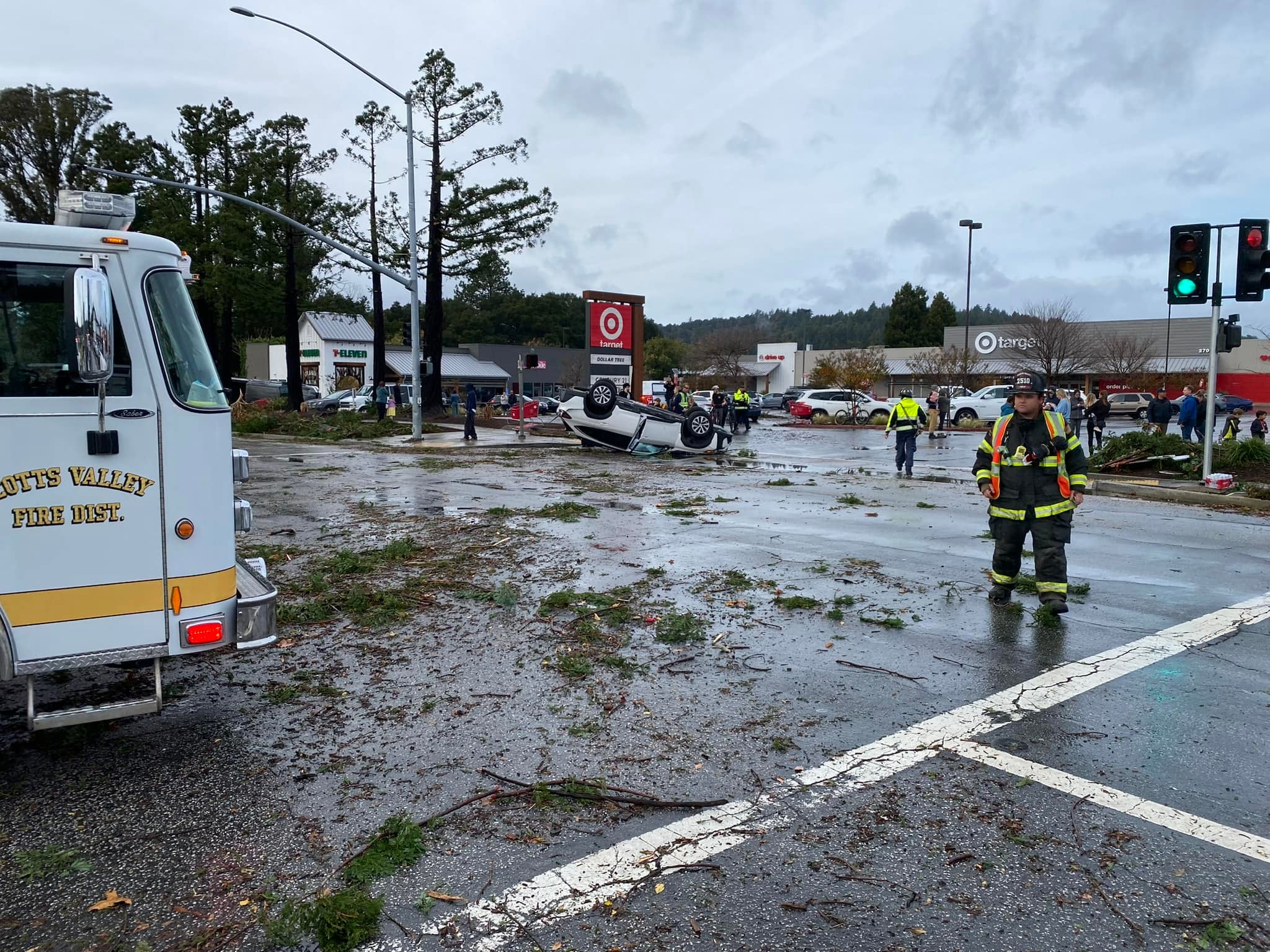 A vehicle and debris litter a Target parking lot after a twister tears through Scotts Valley, California. Multiple people were injured by the tornado