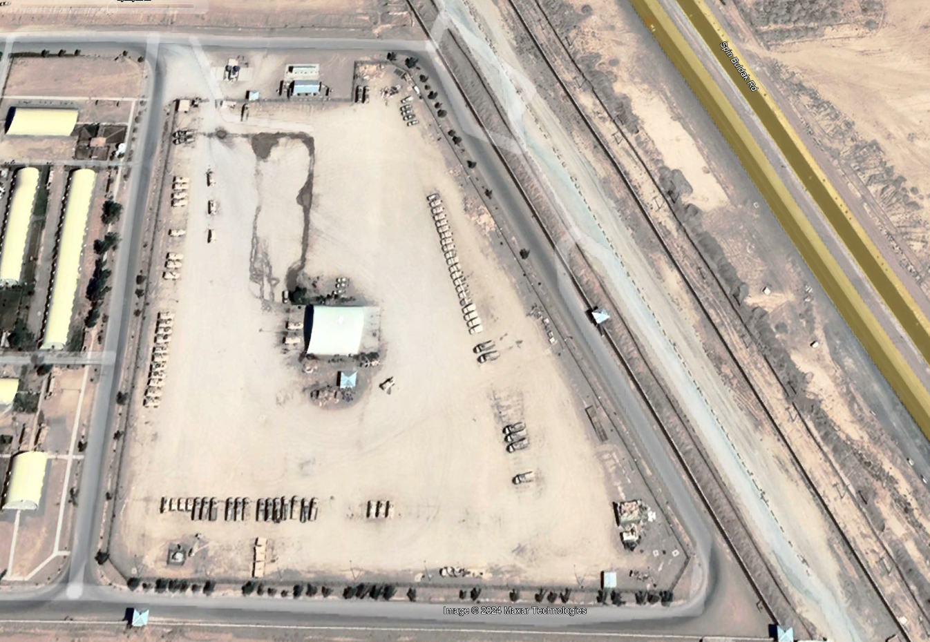 A satellite view from 2019 of Humvees and other military vehicles parked at the Kandahar airbase, the main point for the Nato forces inside Afghanistan