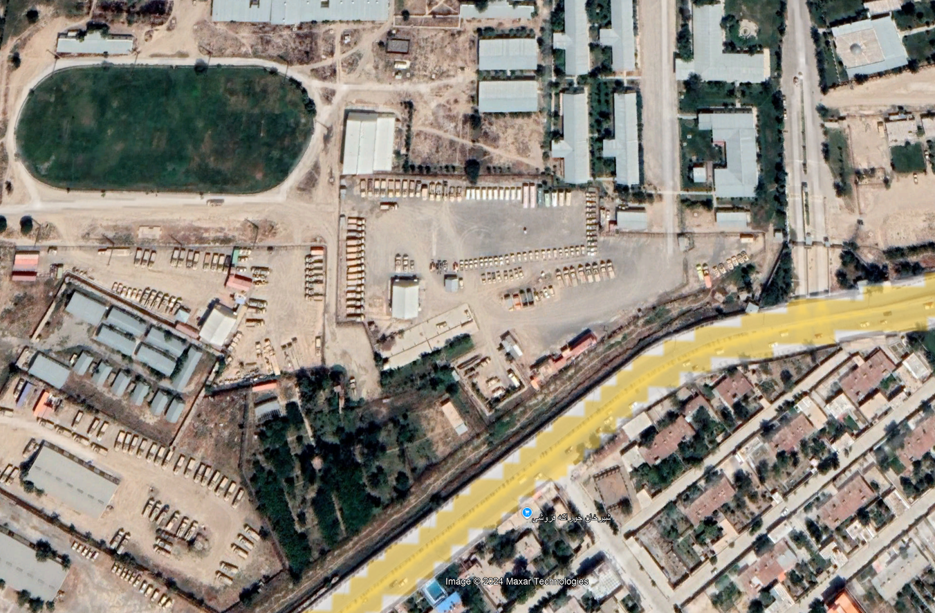 A satellite view of neatly parked Humvees and other military vehicles near Kabul International Airport in 2019