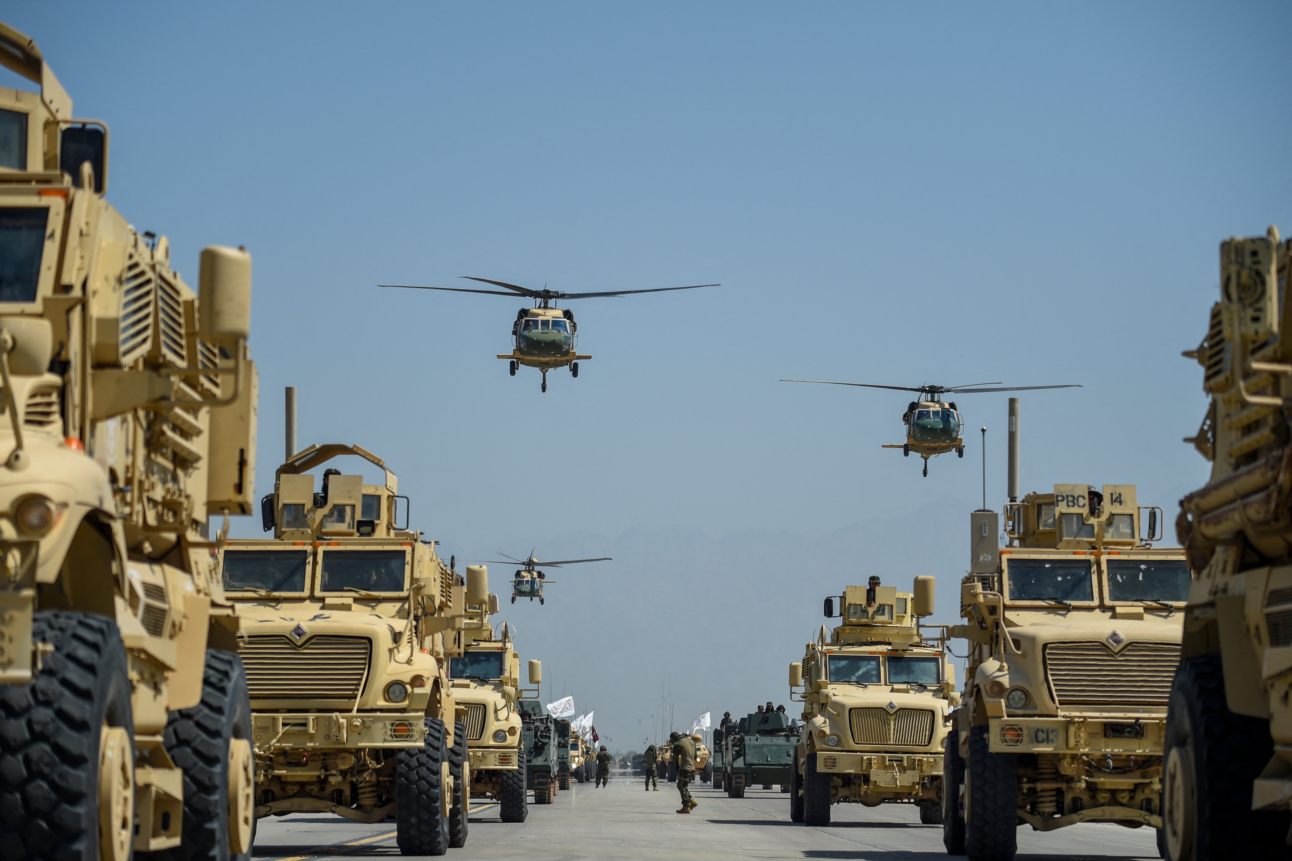 Taliban military helicopters fly to celebrate the third anniversary of Taliban’s takeover of Afghanistan