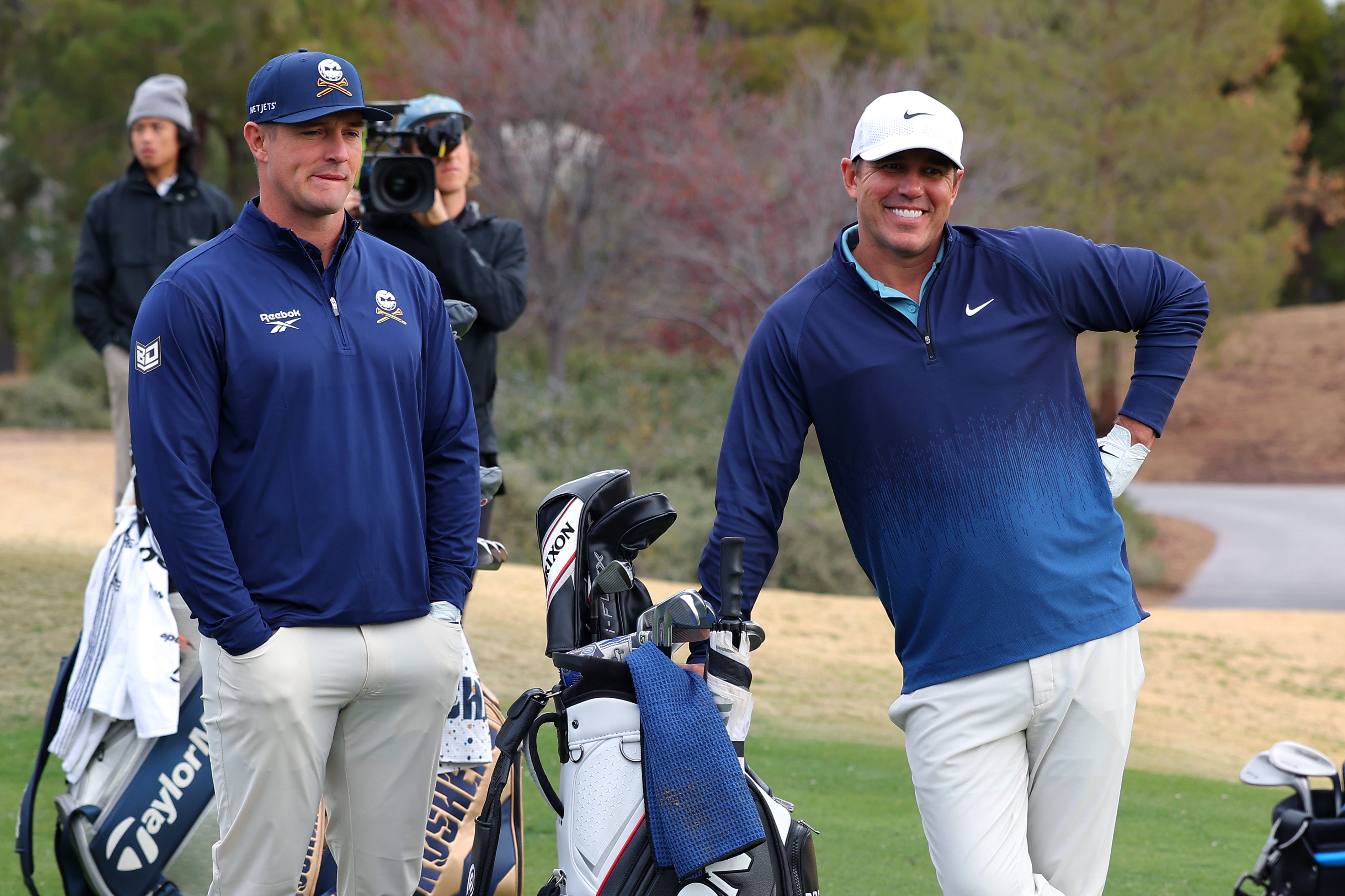 Bryson DeChambeau and Brooks Koepka of LIV Golf look on before The Showdown