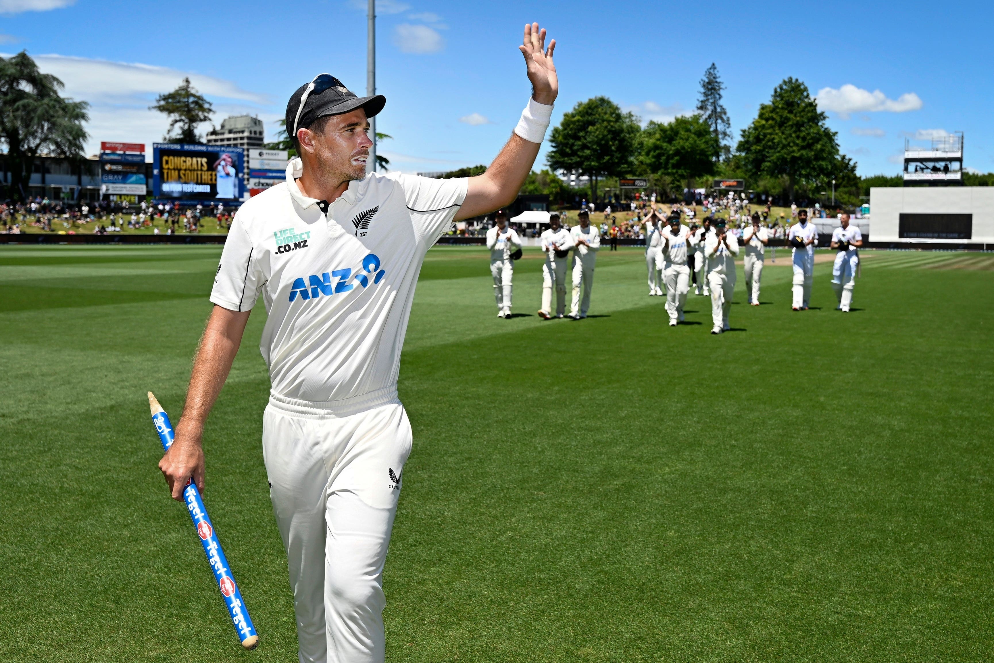 New Zealand’s Tim Southee waves as he leads his team from the field (Andrew Cornaga/Photosport/AP)