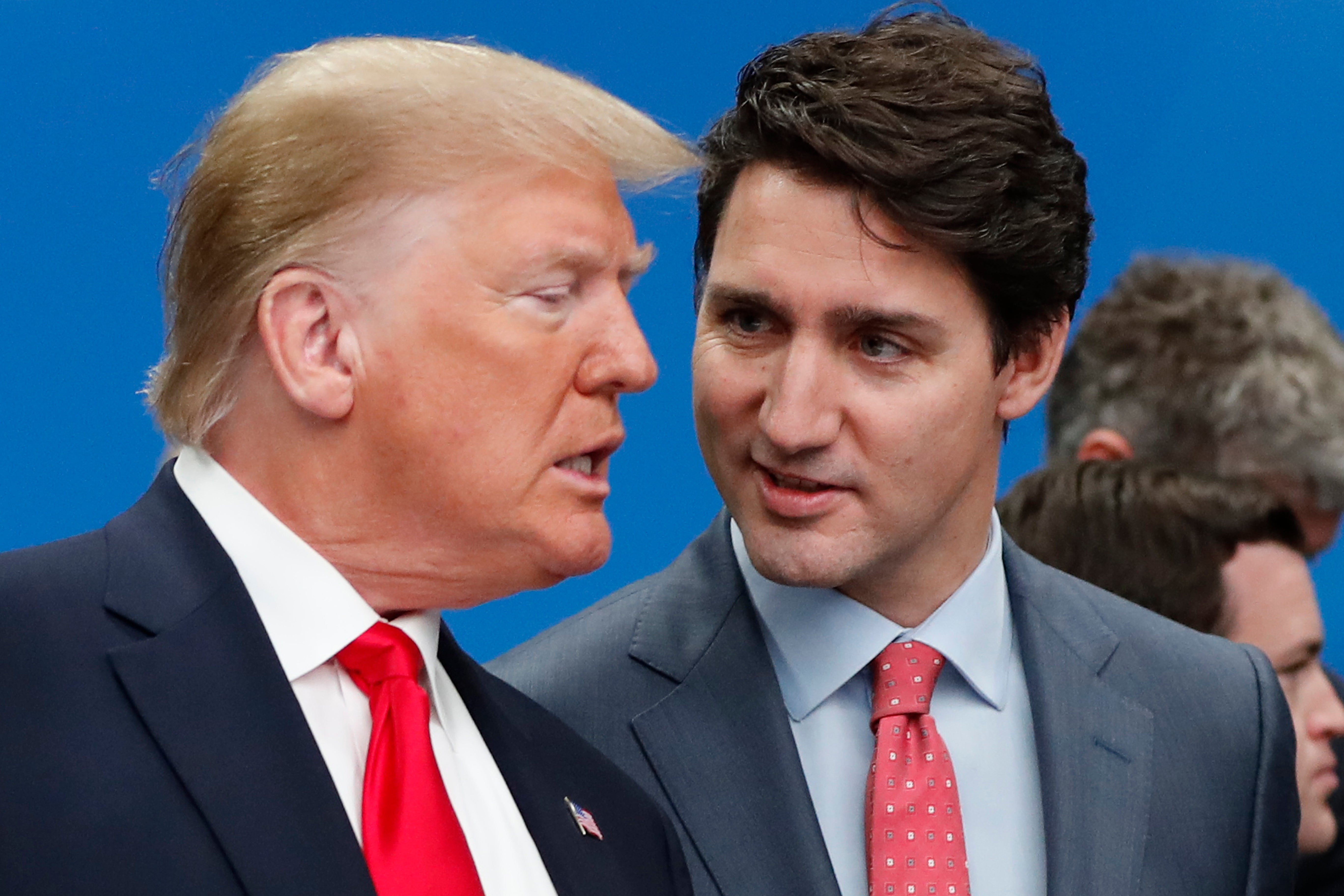 US President Donald Trump, left, and Canadian Prime Minister Justin Trudeau talk prior to a NATO round table meeting at The Grove hotel and resort in Watford, Hertfordshire, England, December 4, 2019