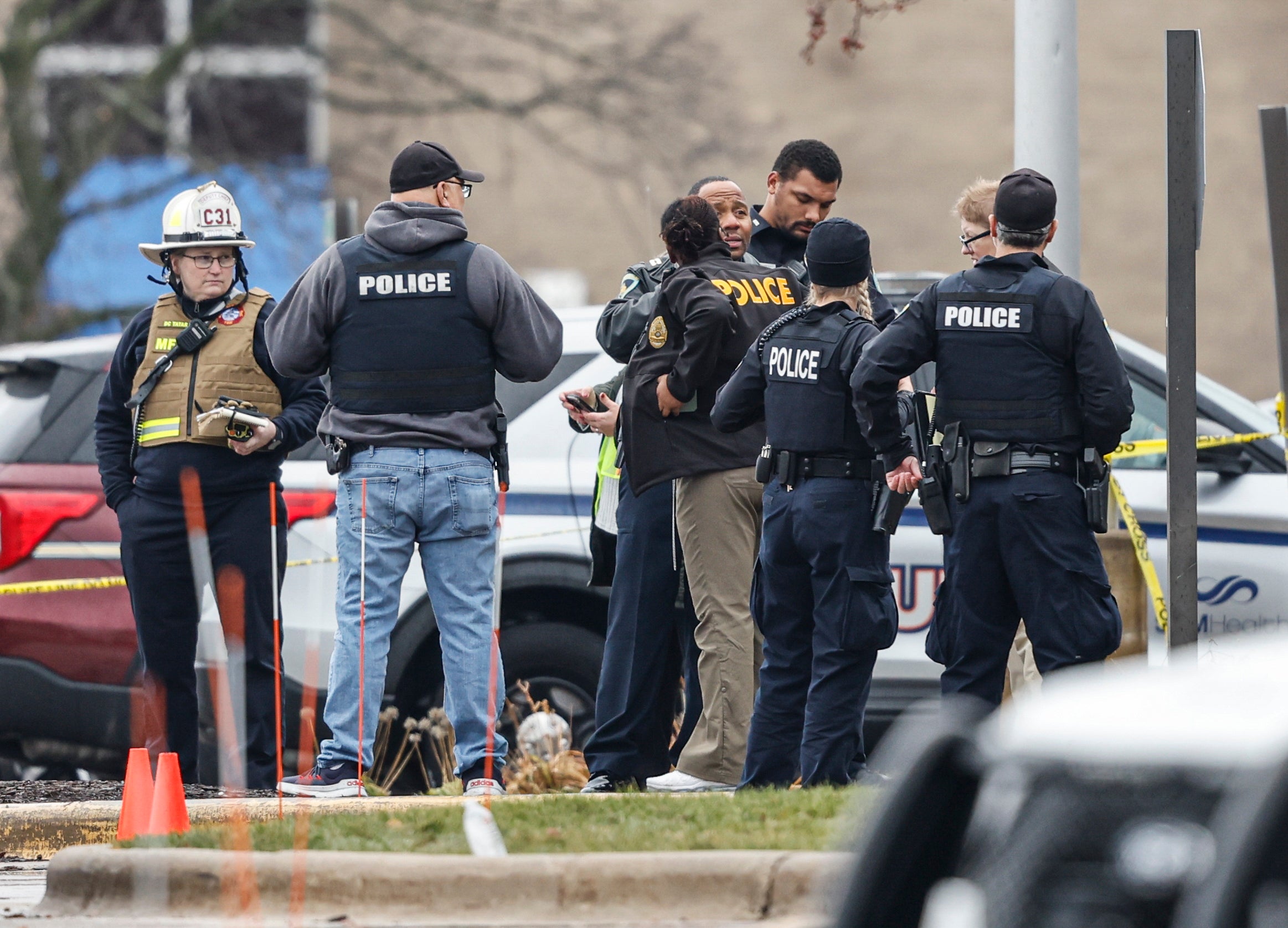 Police gather at a reunification center after a shooting at Abundant Life Christian School in Madison, Wisconsin