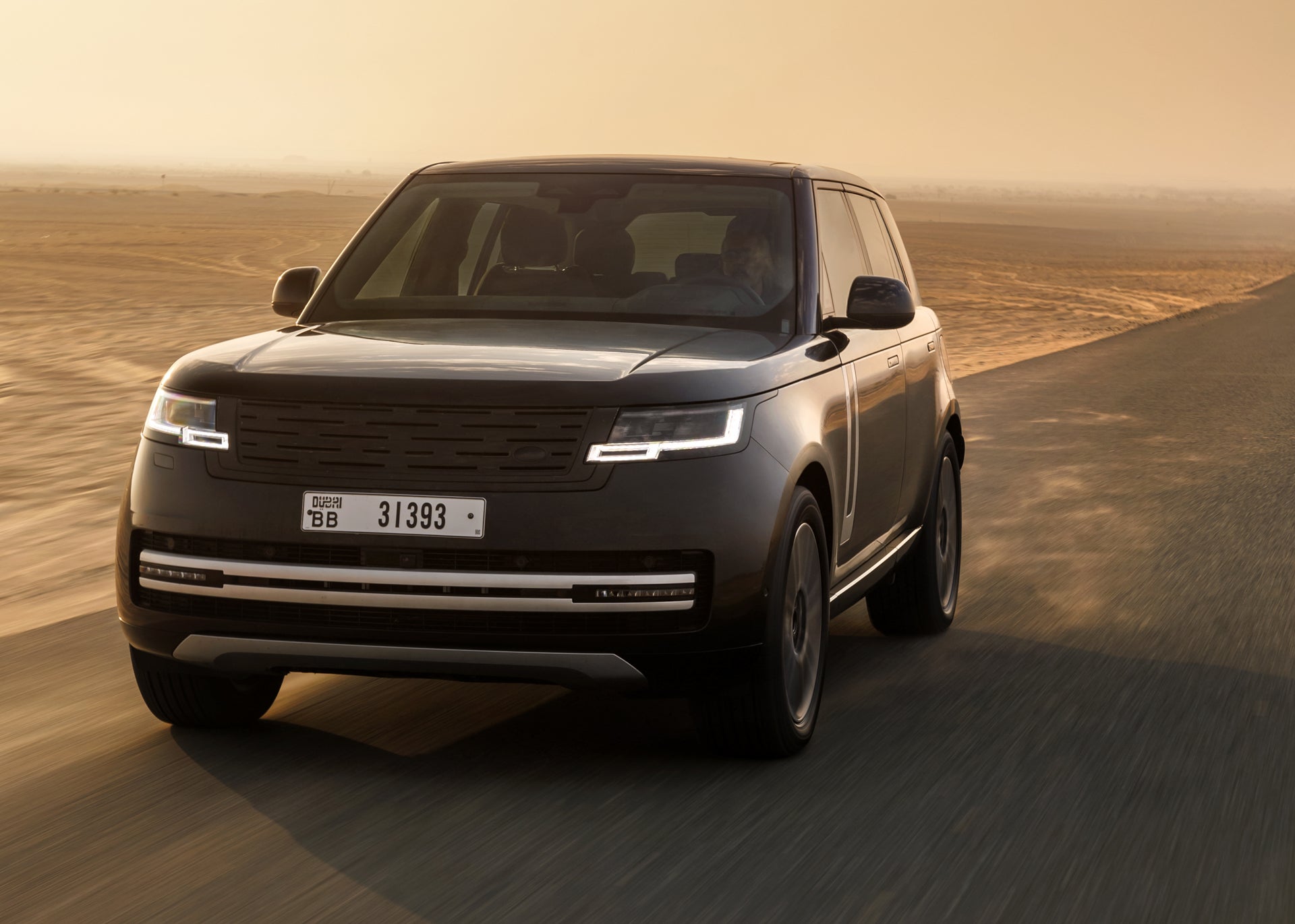 A Range Rover Electric prototype undergoing hot weather testing in Dubai