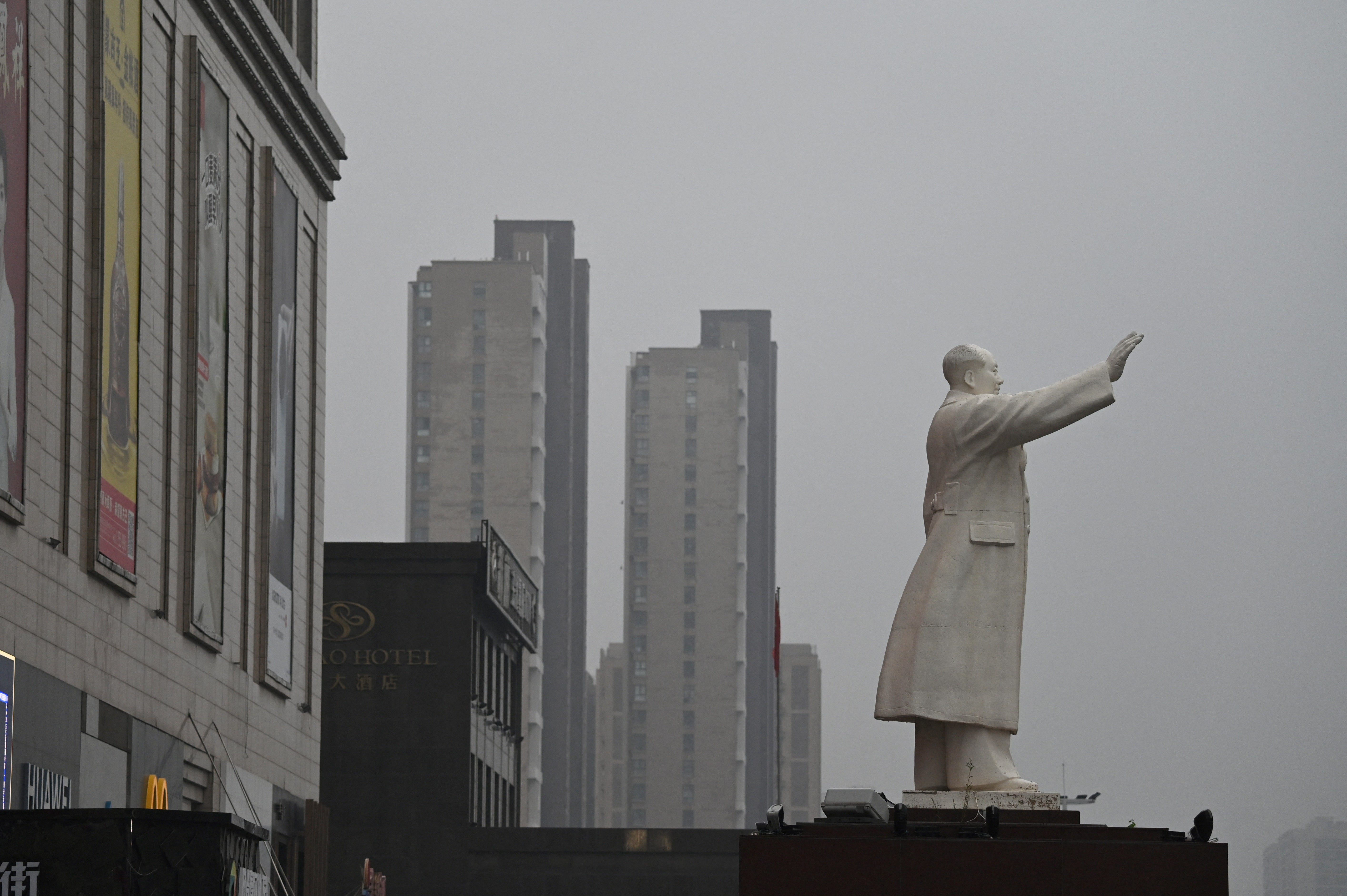 A statue of late communist leader Mao Zedong stands outside a shopping mall in Baotou in China's northern Inner Mongolia region