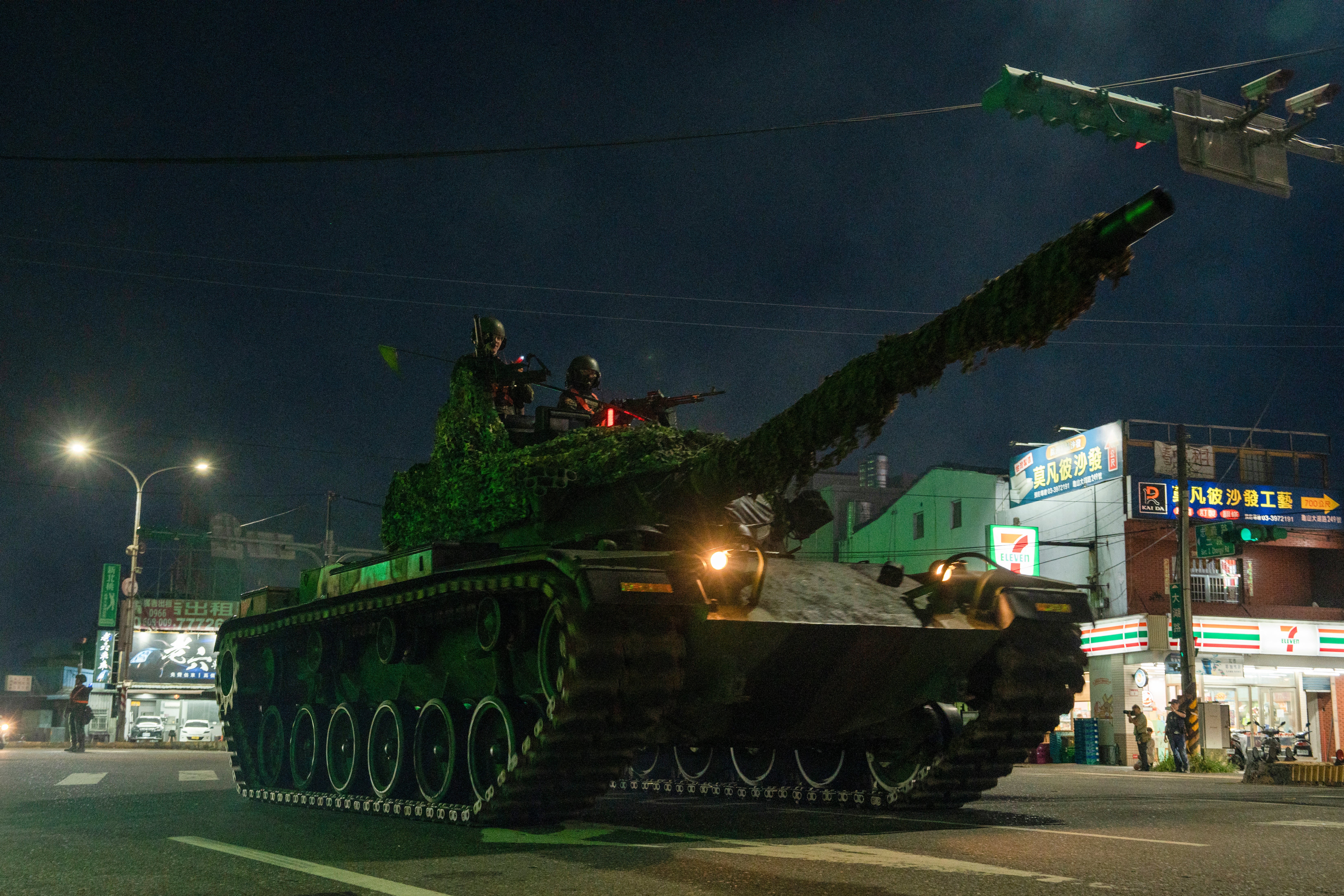 File: A main battle tank drives through the streets of Taoyuan as part of an exercise