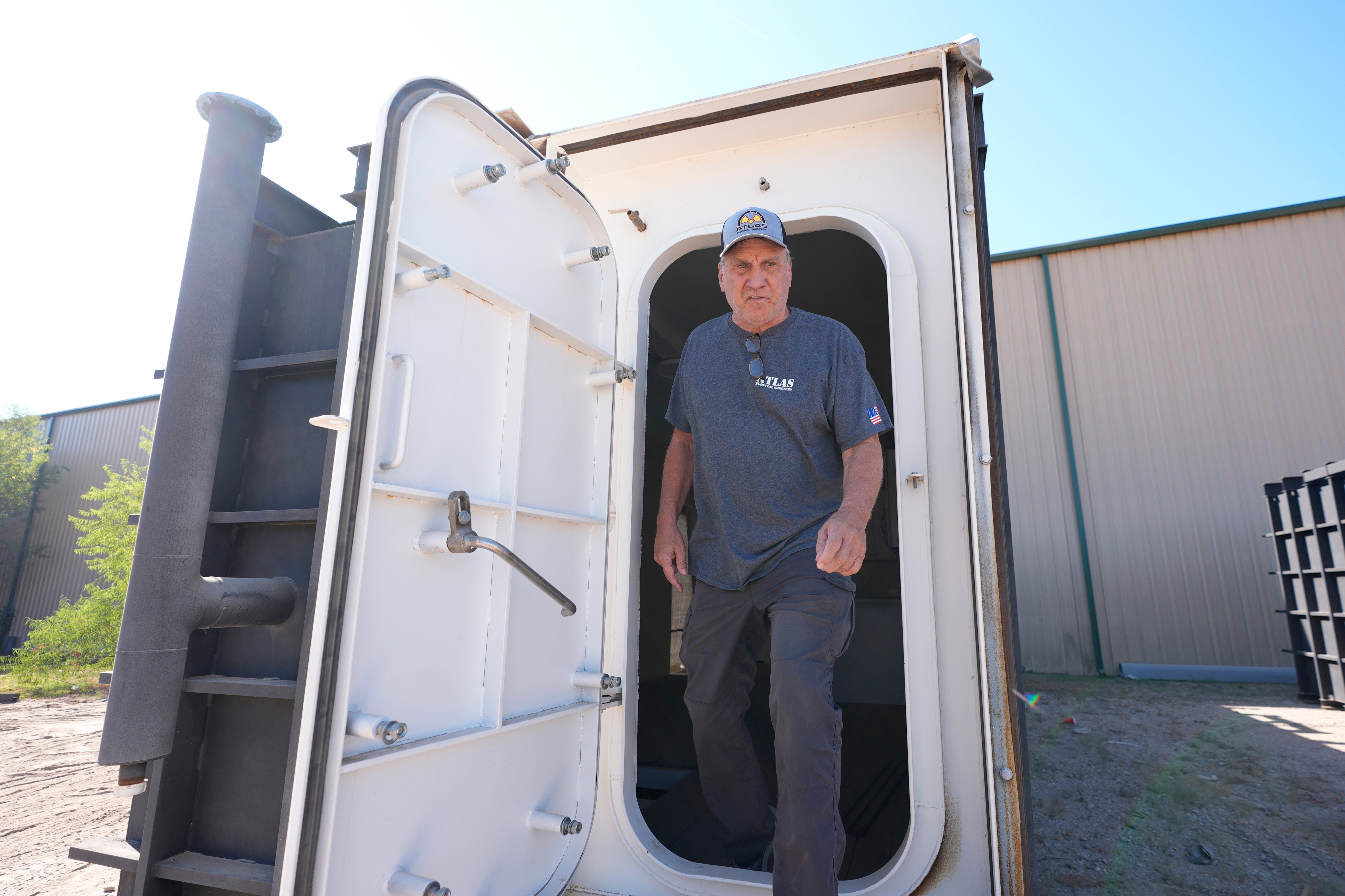 Ron Hubbard, owner of Atlas Survival Shelters, walks out the door of a bunker