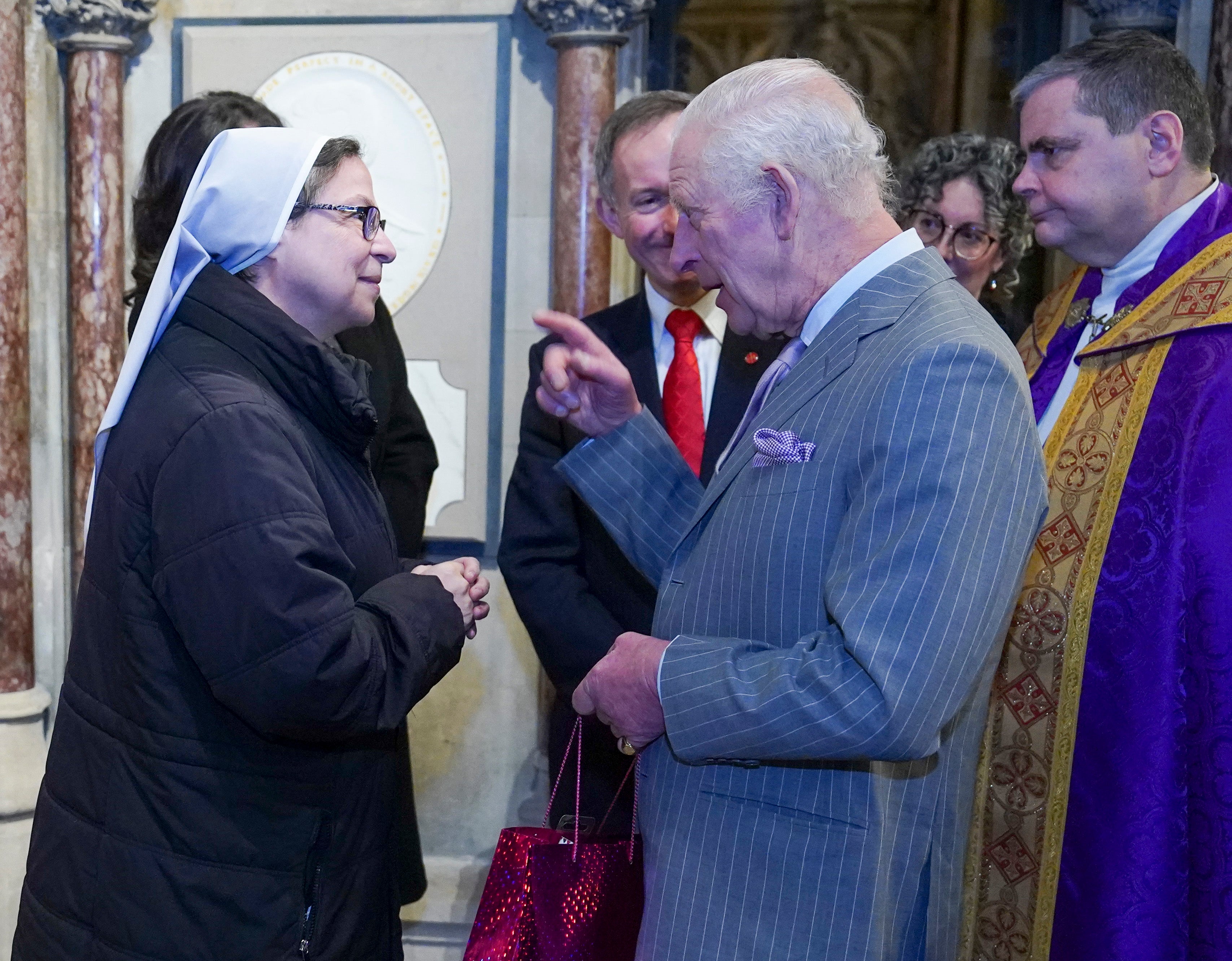 Charles met a Syrian nun when he joined a Catholic congregation at the event held at the Catholic Farm Street Church in Mayfair .