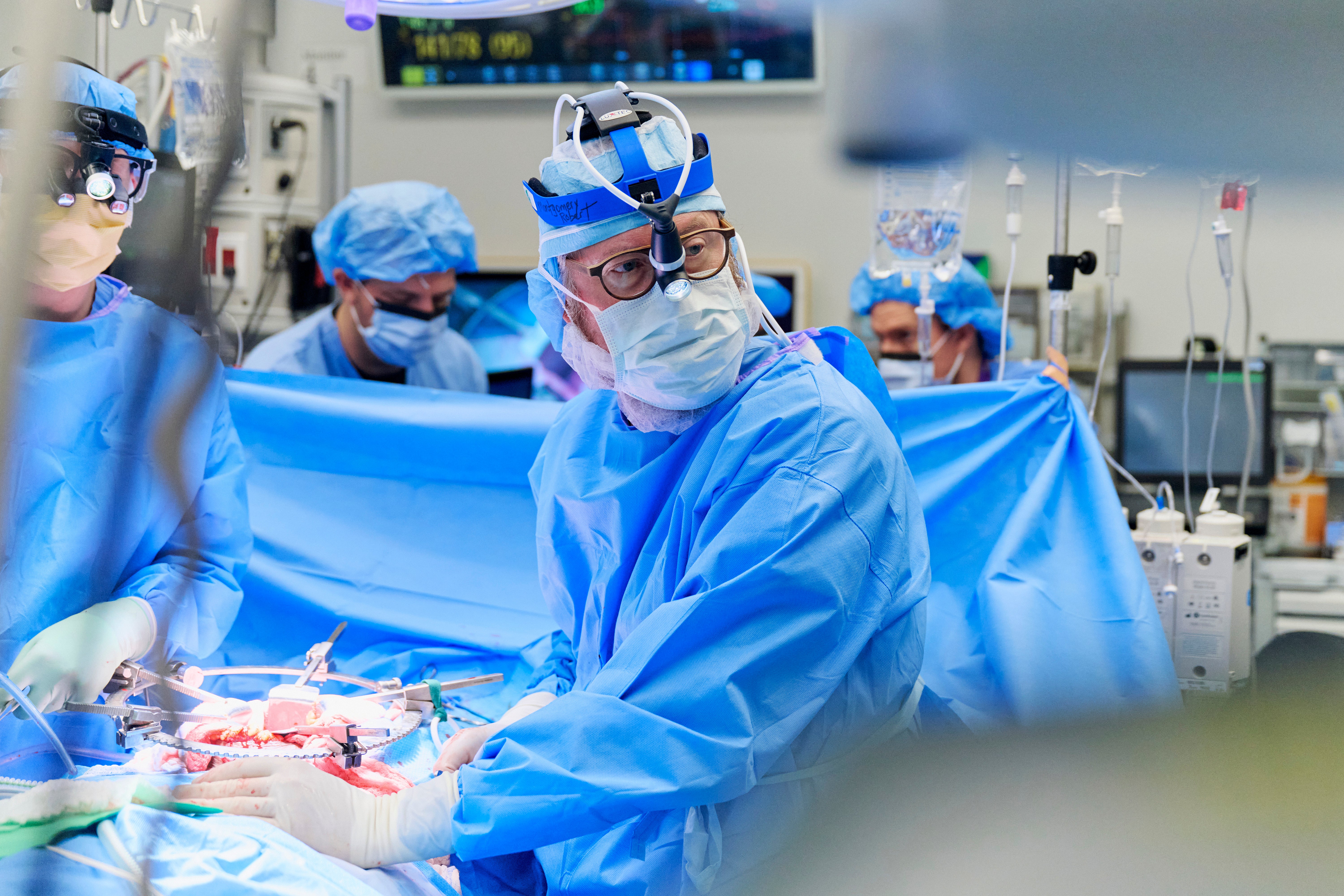 Montgomery looks at a monitor during the gene-edited pig kidney transplant surgery in November. He led the experimental procedure