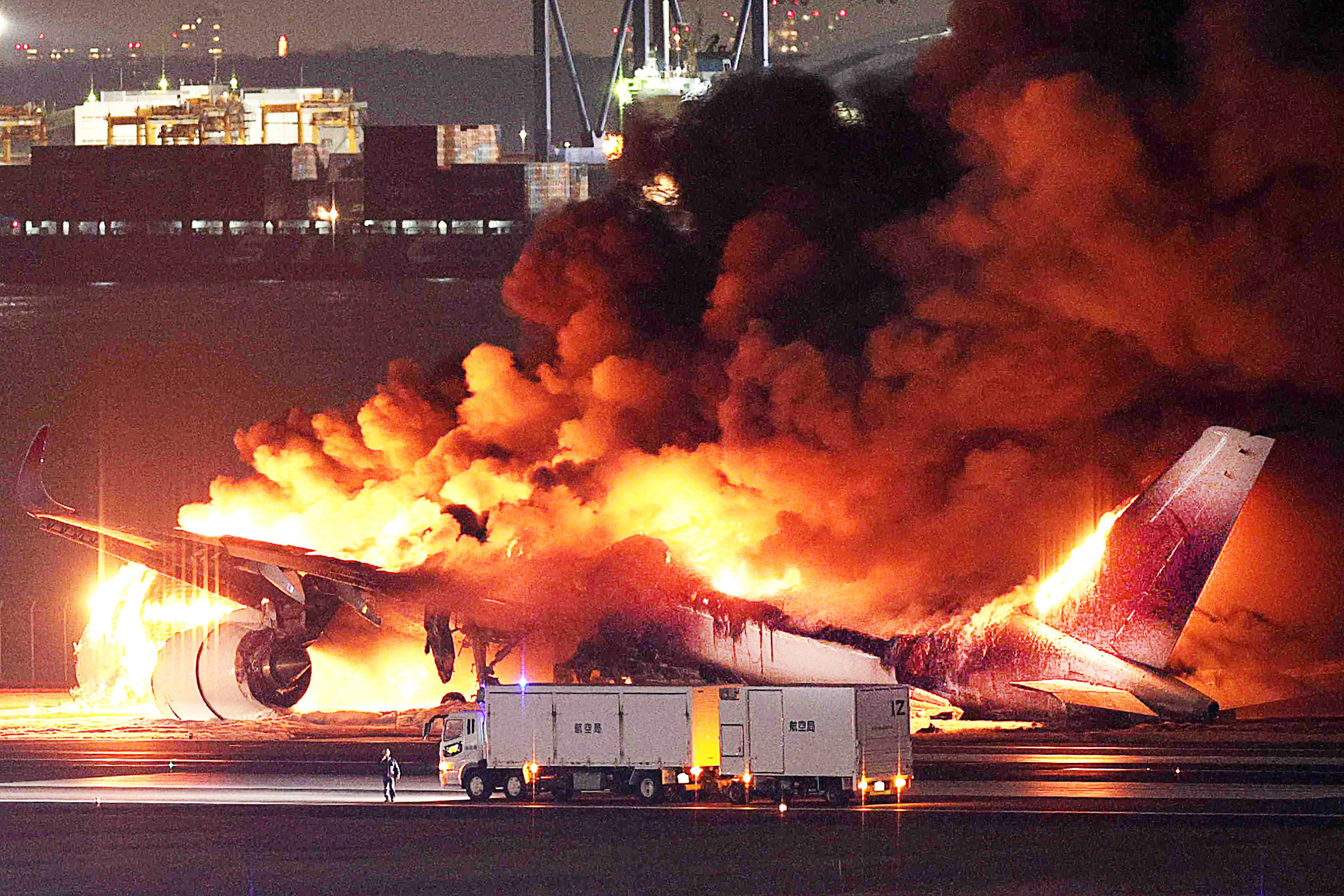 The Japan Airlines A350 in flames after landing in Tokyo in January. All 379 on board survived