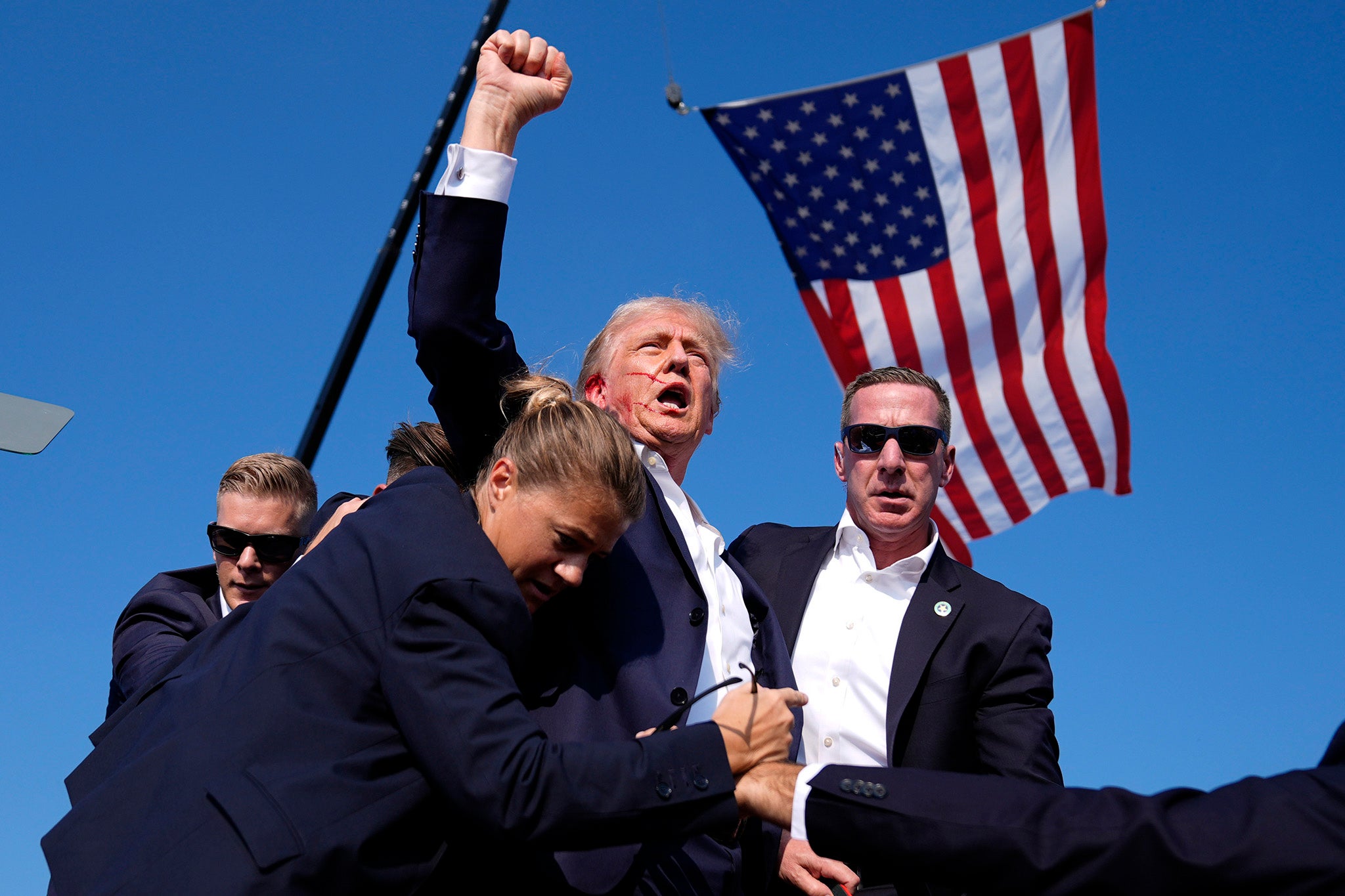 A now-iconic photo of Donald Trump raising his fist after being shot in the ear at a rally in Pennsylvania