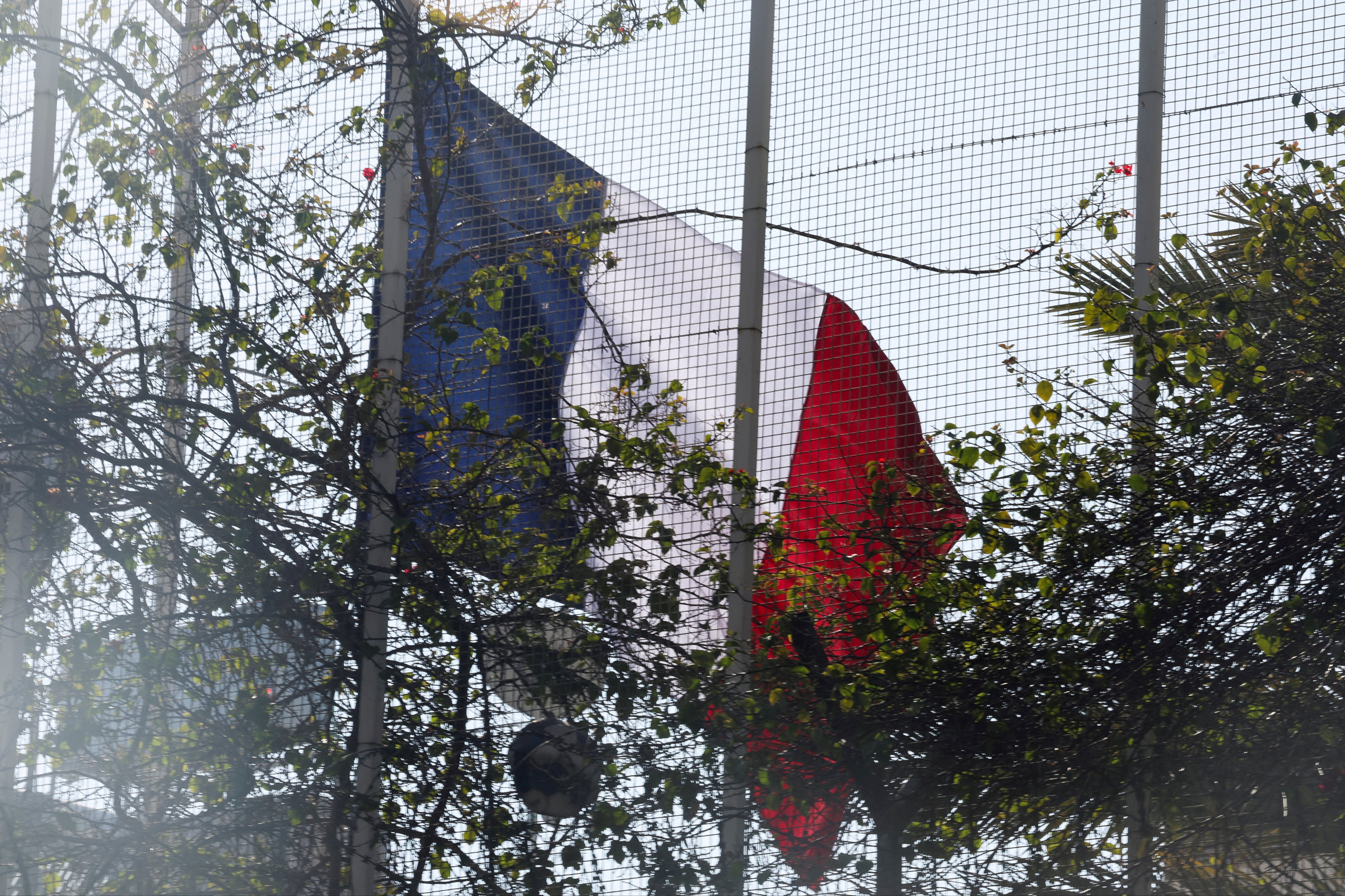 The French national flag is raised at the French embassy in Damascus