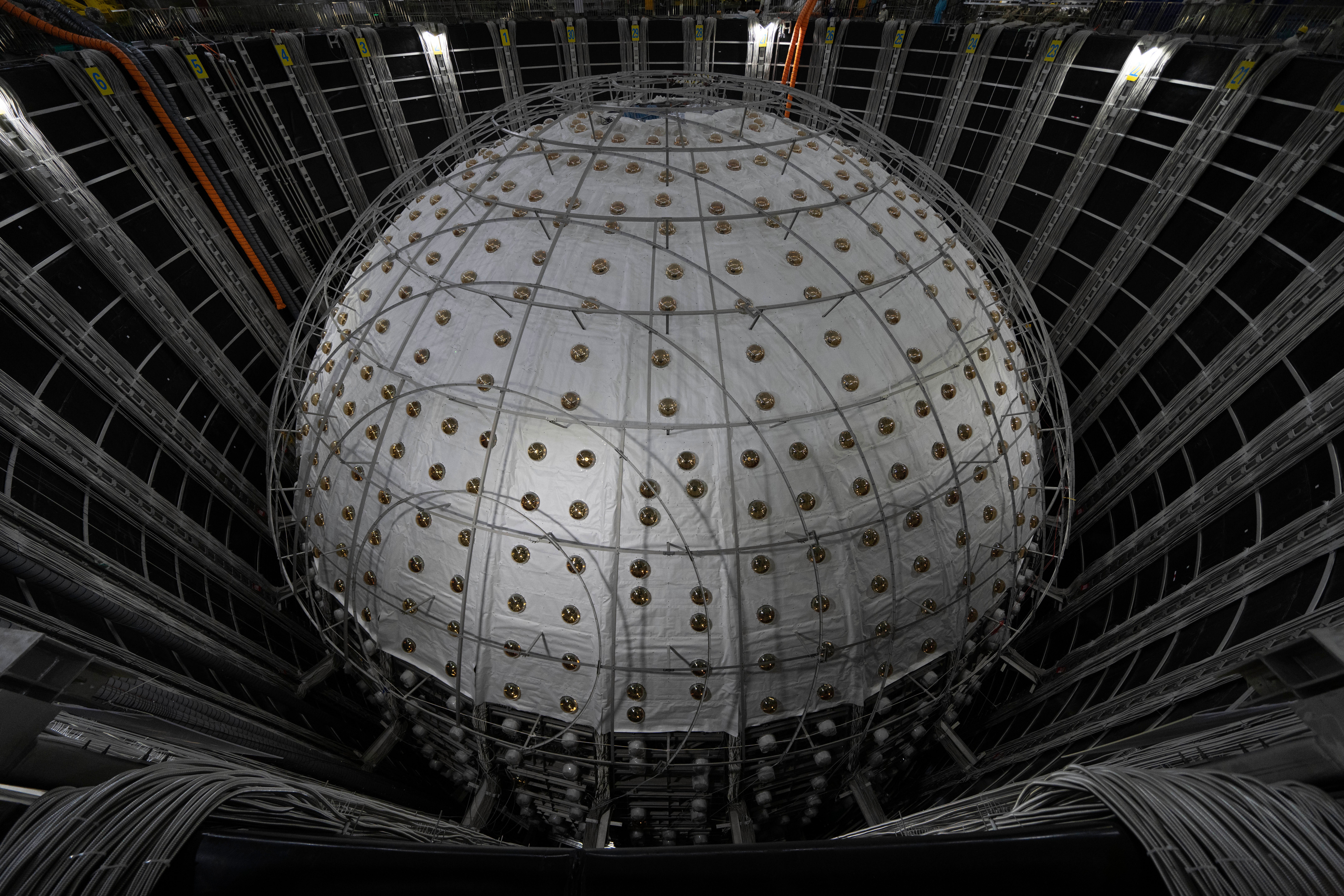 The sphere contains 20,000 tonnes of a substance known as a liquid scintillator
