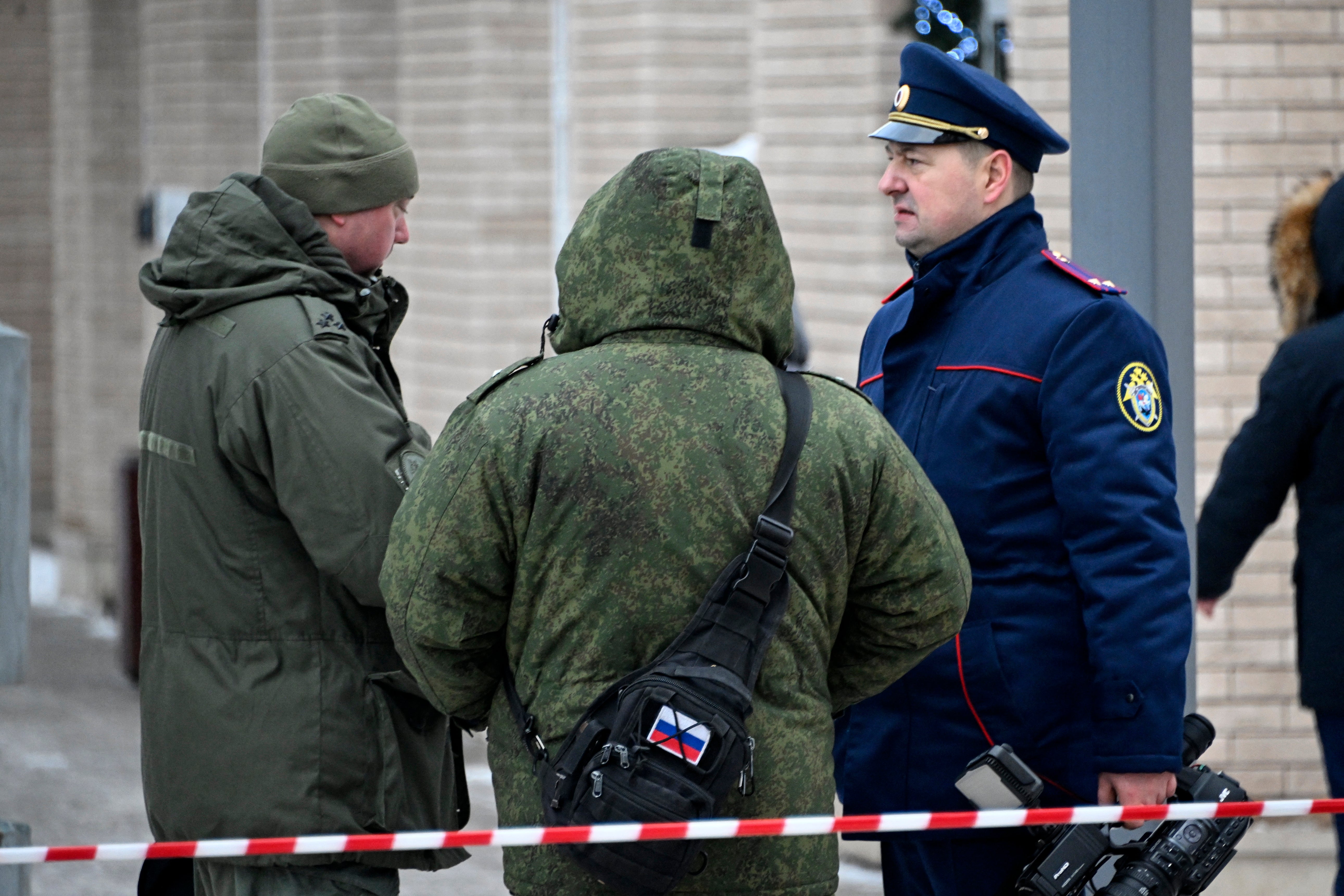 Investigators work at the blast scene which killed Igor Kirillov and his assistant in Moscow