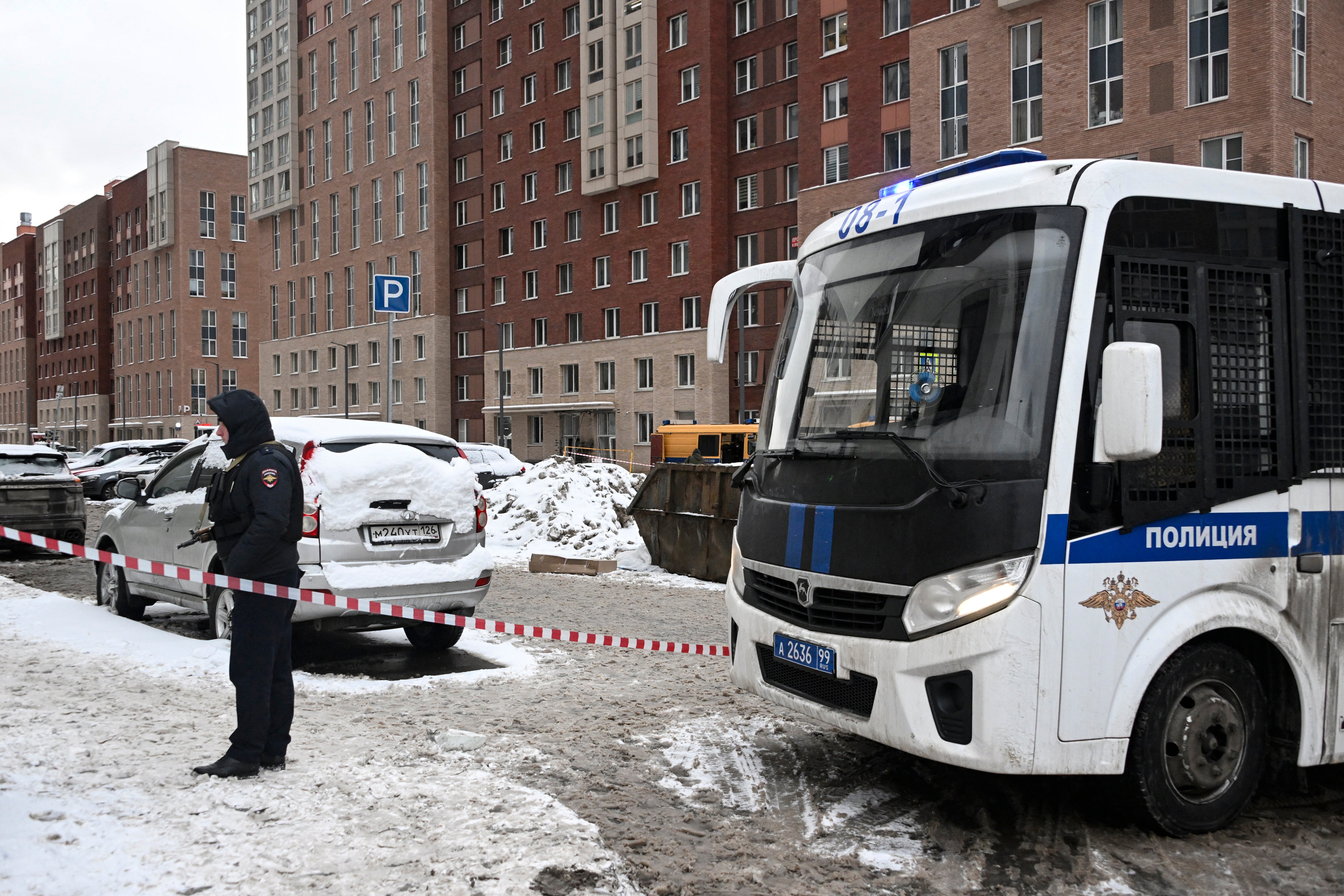 A Russian official and an emergency vehicle seen at the spot of attack that targeted Russian general Igor Kirillov