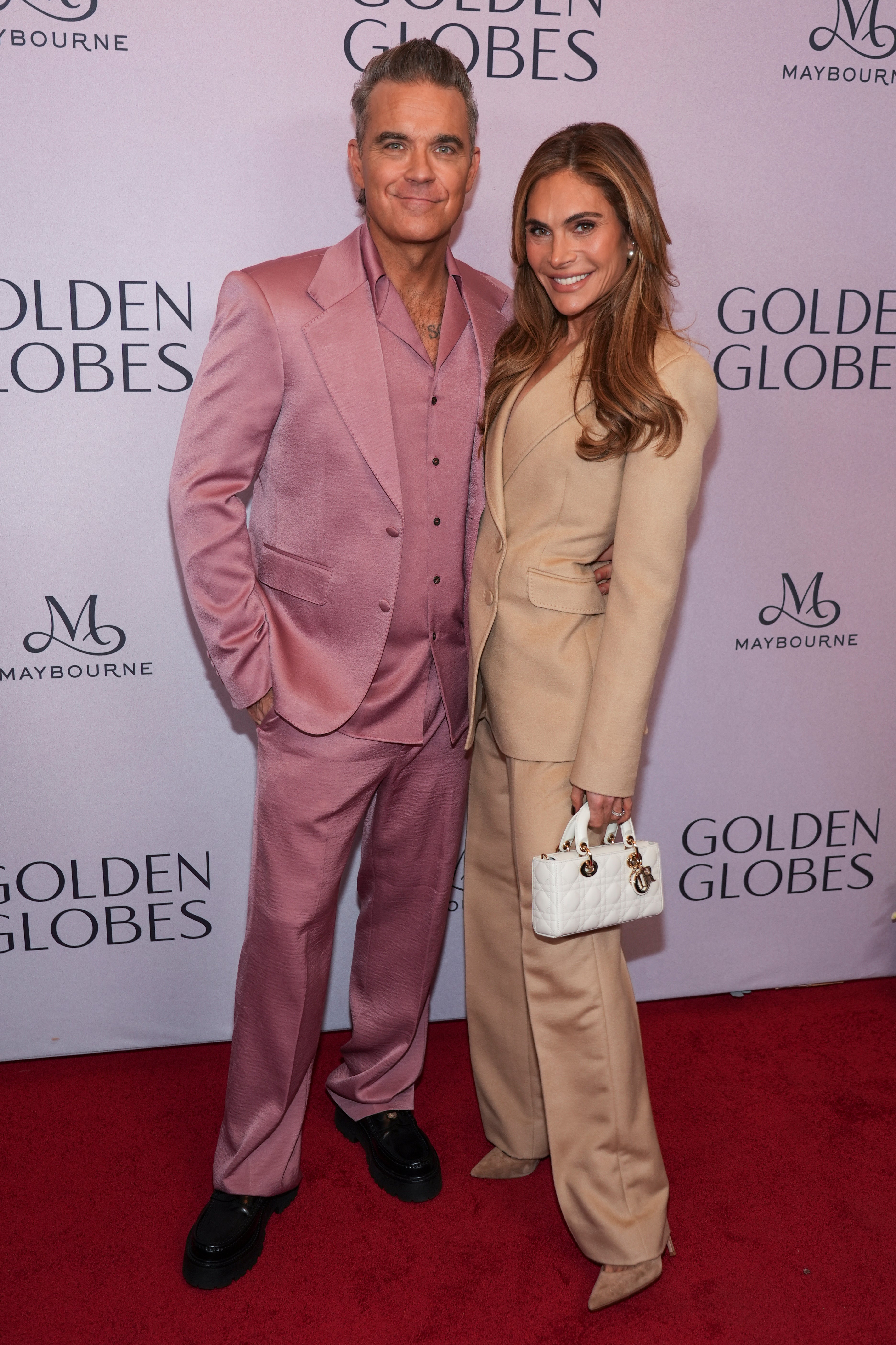 Robbie Williams’ wife Ayda Field Williams also sported a monochromatic suit, opting for beige (Chris Pizzello/AP)