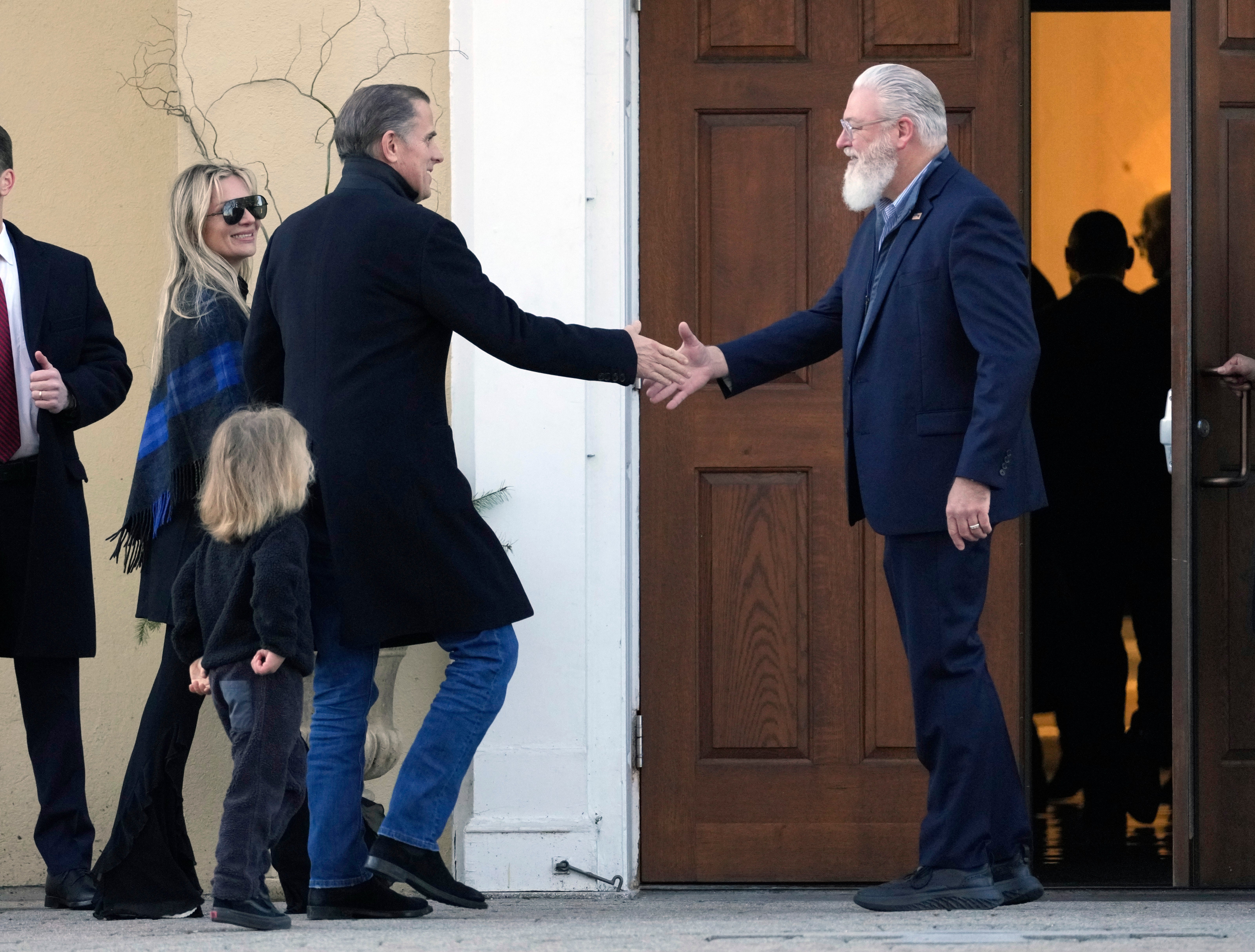 Hunter Biden, his wife Melissa Cohen Biden and their son Beau are greeted as they arrive