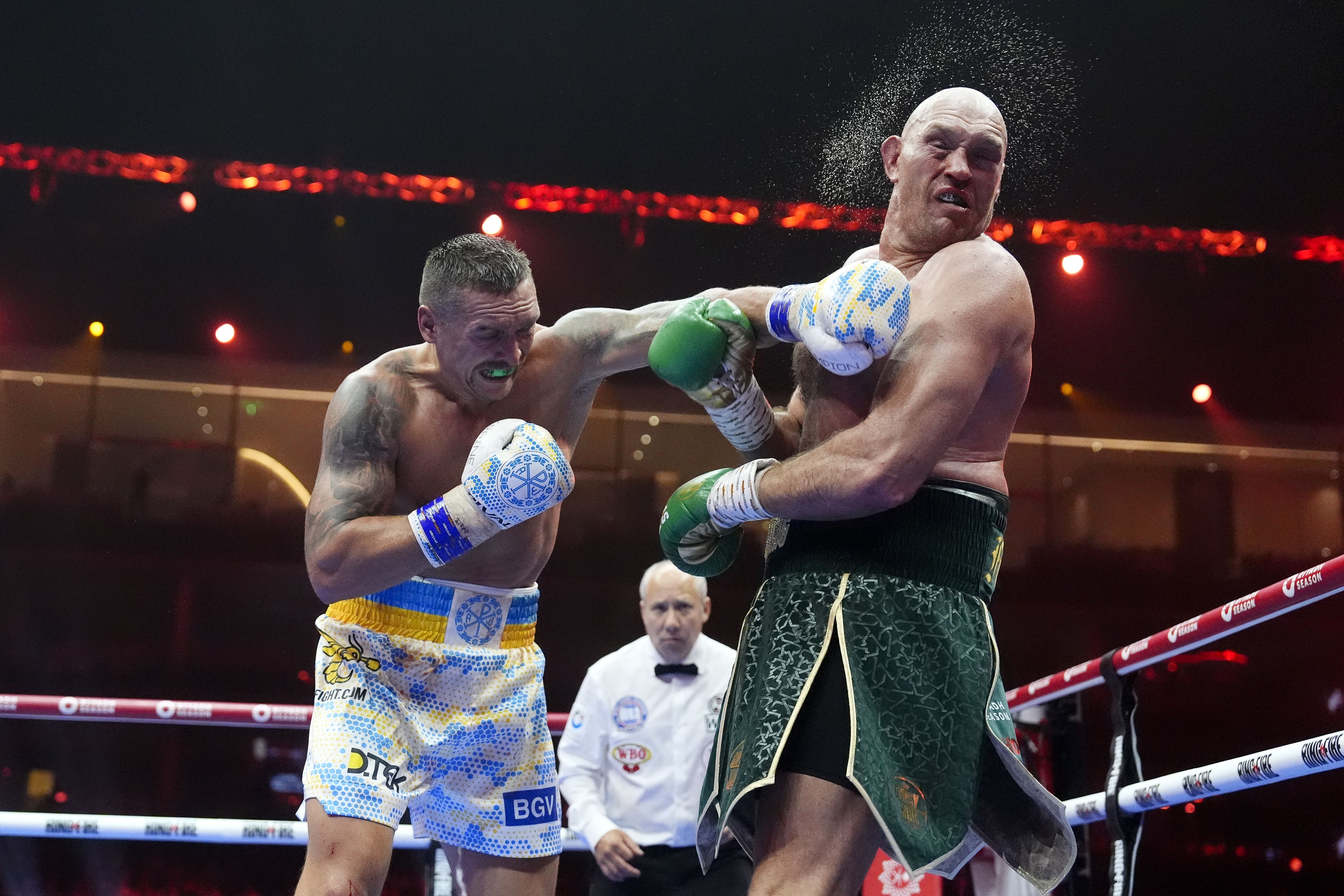 Usyk (left) came close to stopping Fury in round nine of their first showdown