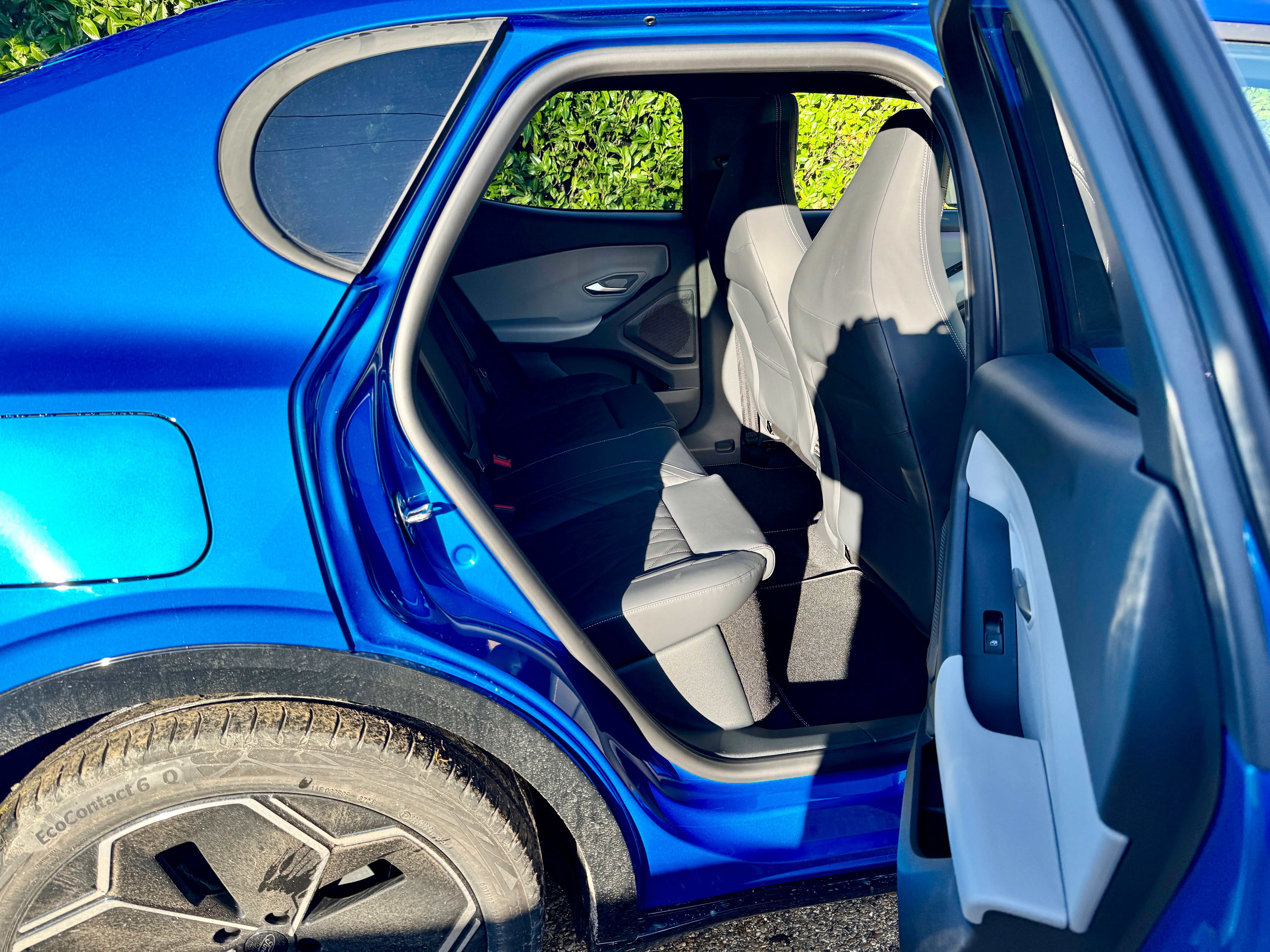 The new Ford Capri back seats are spacious. Shape of rear-most window is a nod to design of old Capris