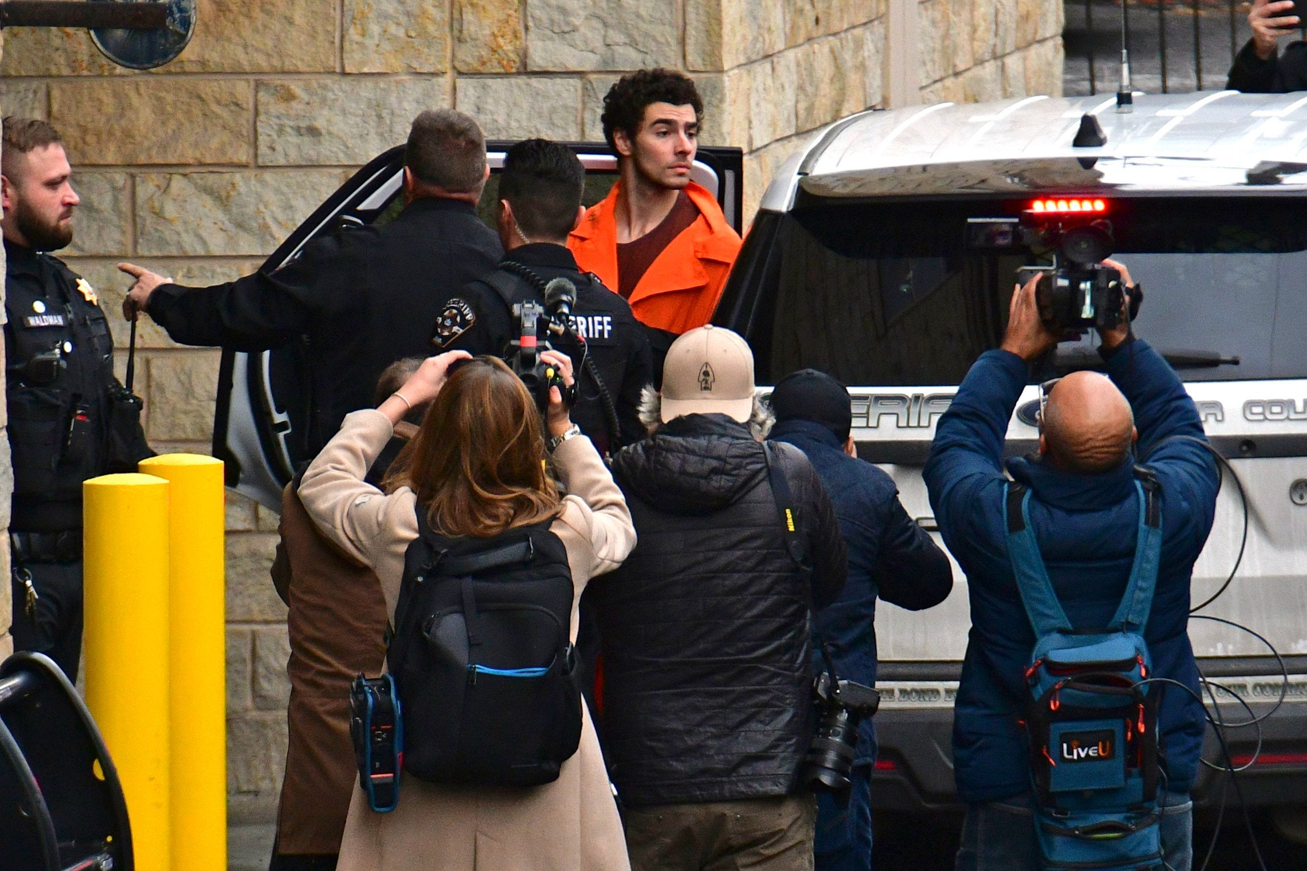 Suspect Luigi Mangione is taken into the Blair County Courthouse on Tuesday, Dec. 10