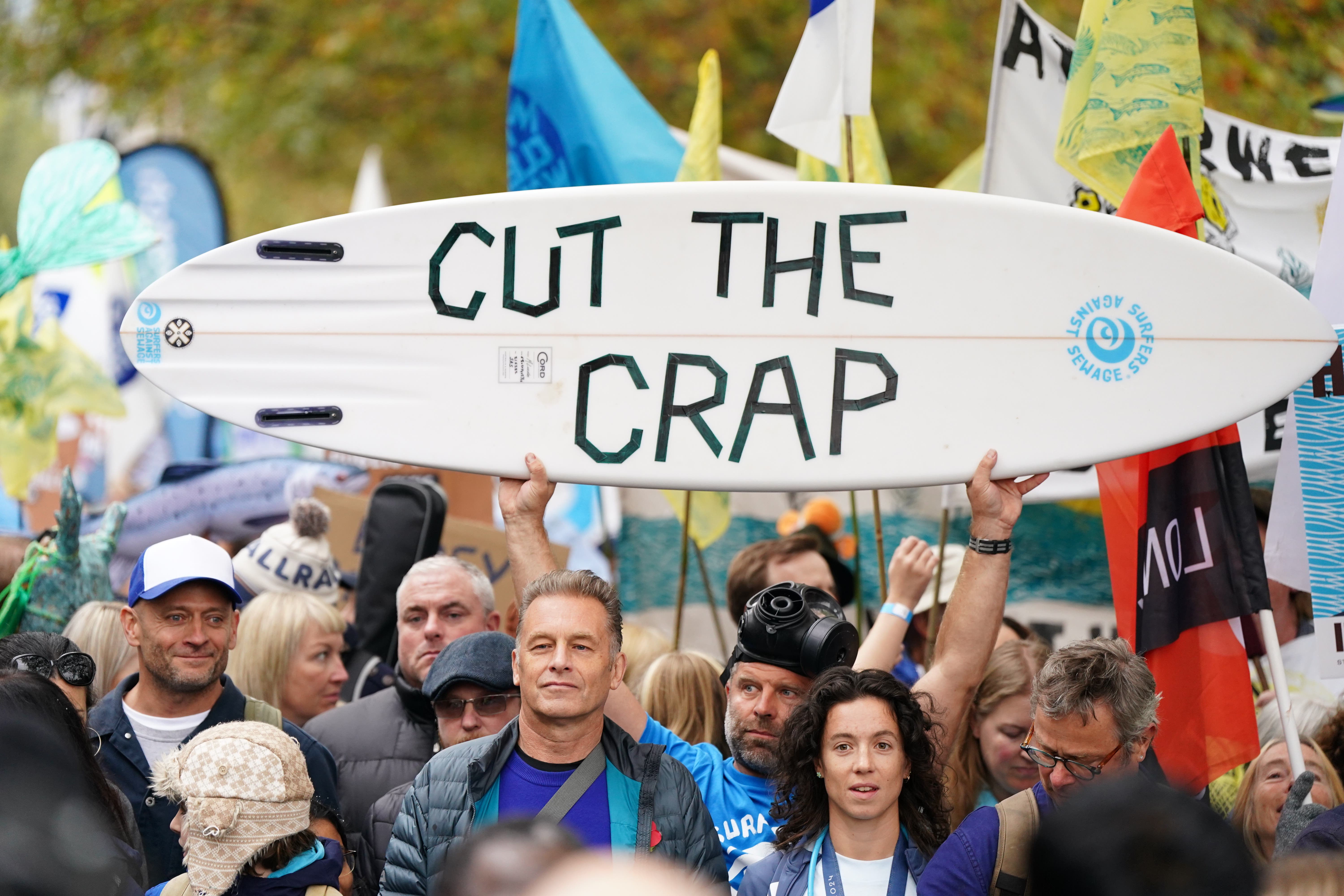 People protesting against sewage pollution by water firms earlier this year (Ben Whitley/PA)