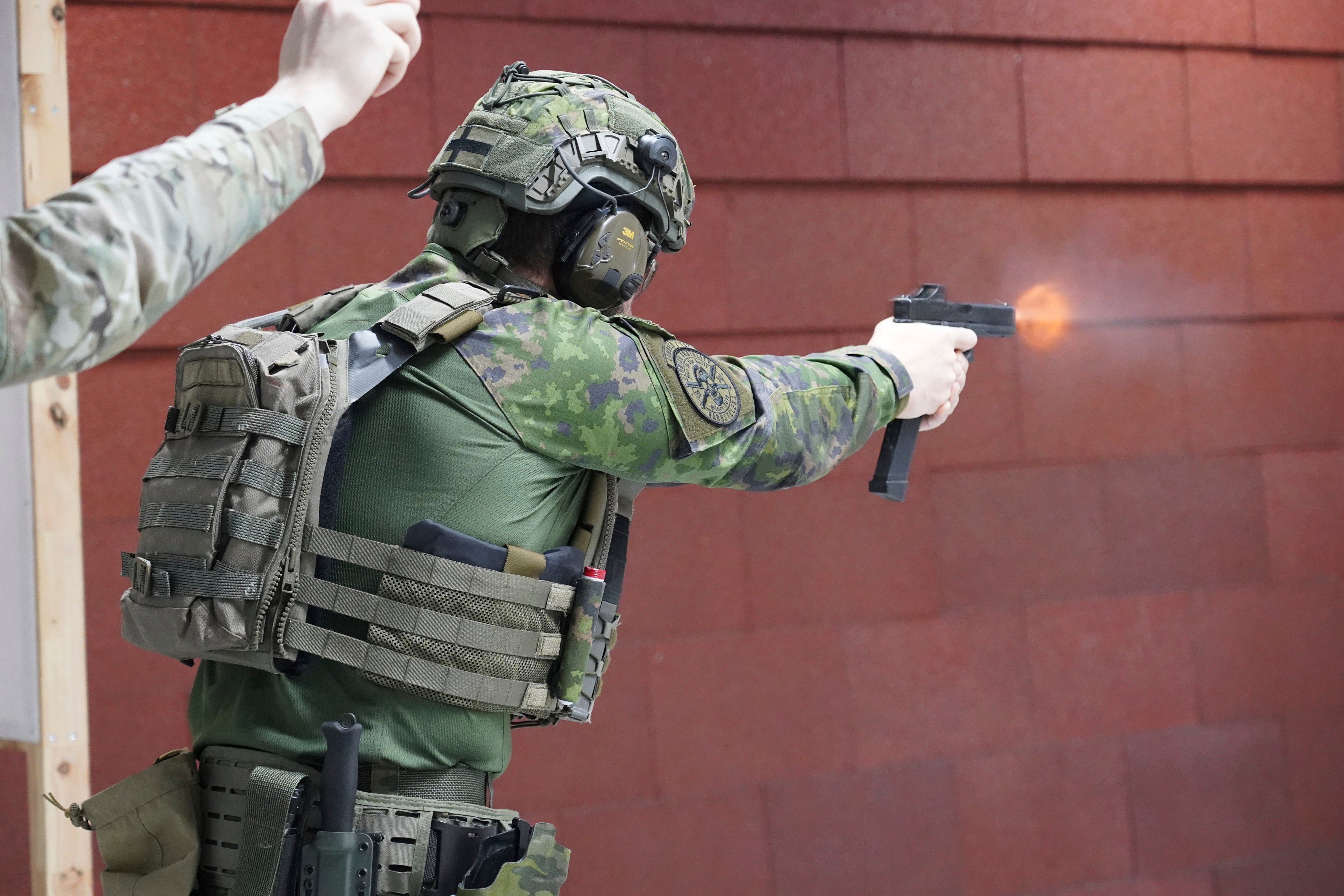 Members of the Vantaa Reservists Association practice at a shooting range in a warehouse in Kerava on the outskirts of Helsinki, Finland