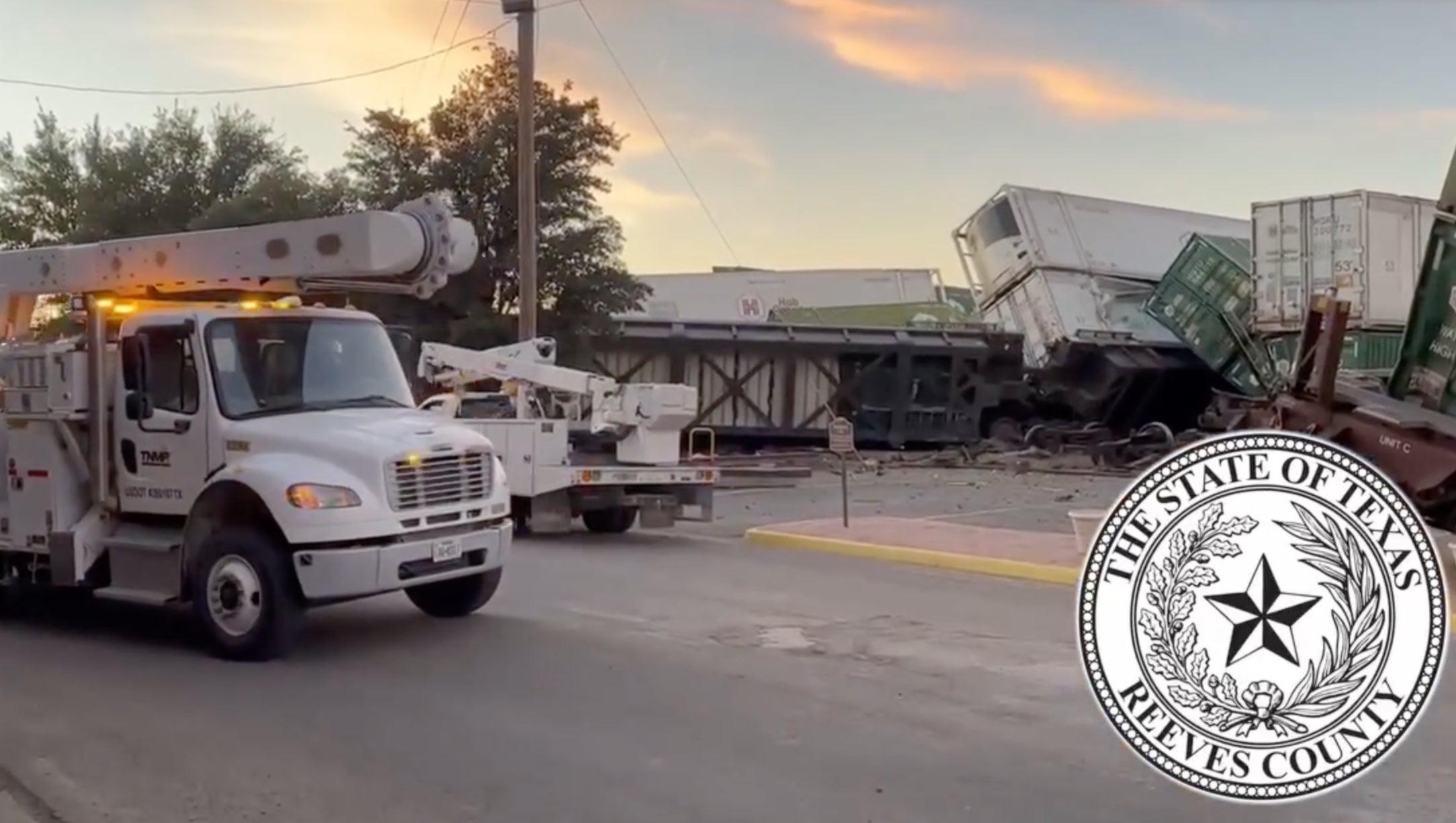 Emergency services go to work after the derailment, containers are shown stacked on top of each other after the derailment