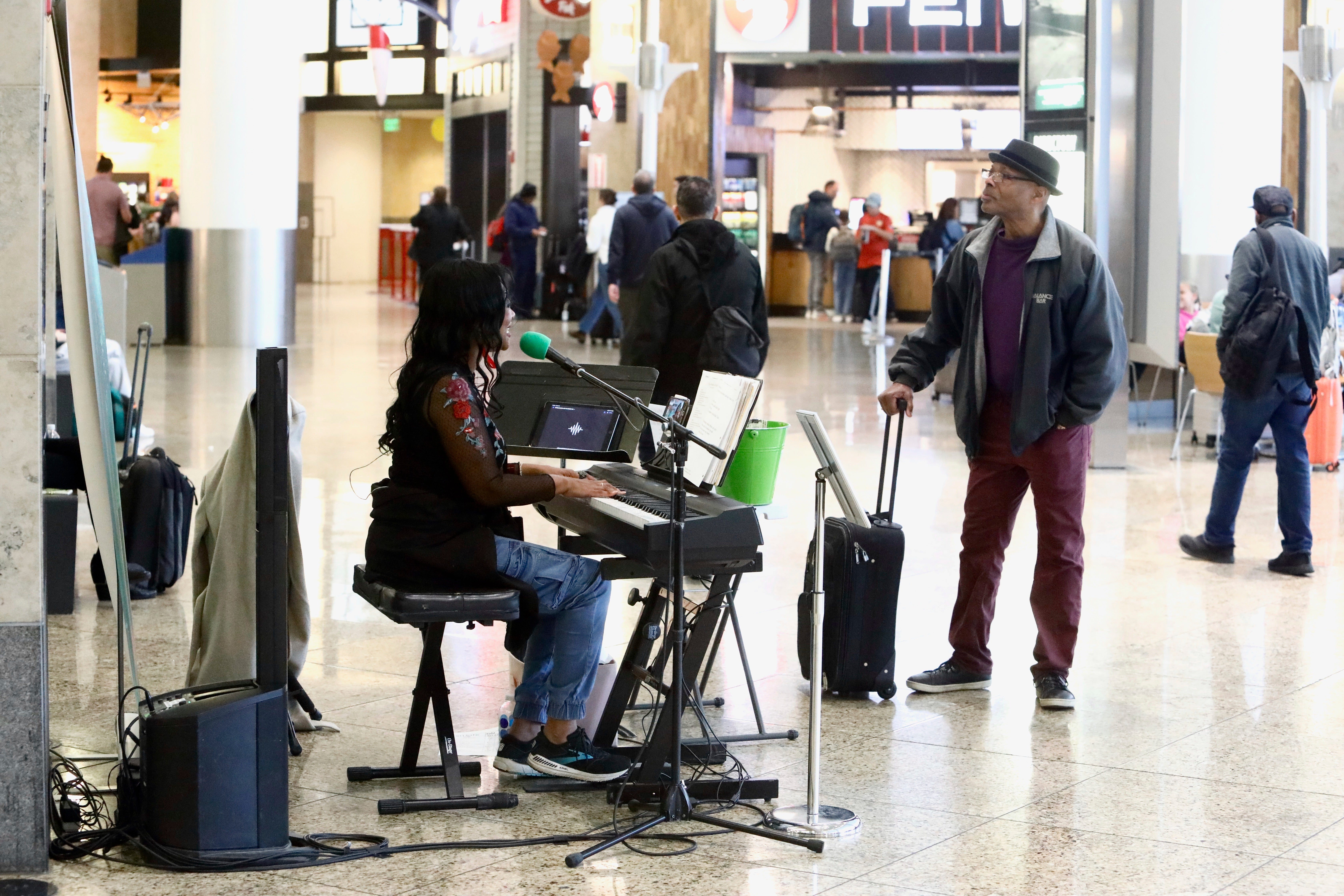 Roz McCommon performs at Seattle-Tacoma International Airport on November 26, 2024, in SeaTa