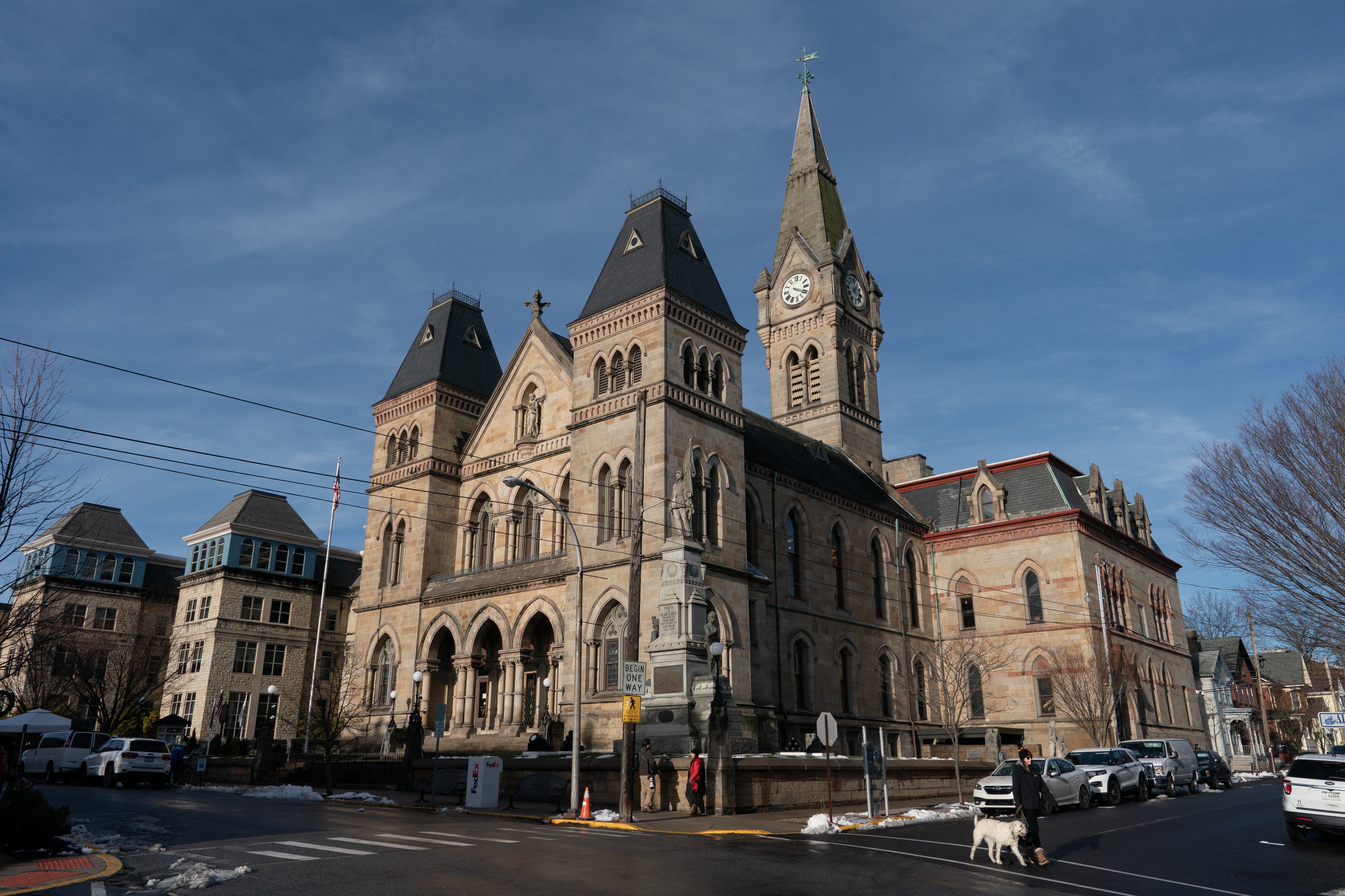 A person walks past Blair County Courthouse, where Luigi Mangione, the suspect in United Healthcare CEO Brian Thompson's death, is due to appear in court on December 19, in Hollidaysburg, Pennsylvania, on December 17, 2024