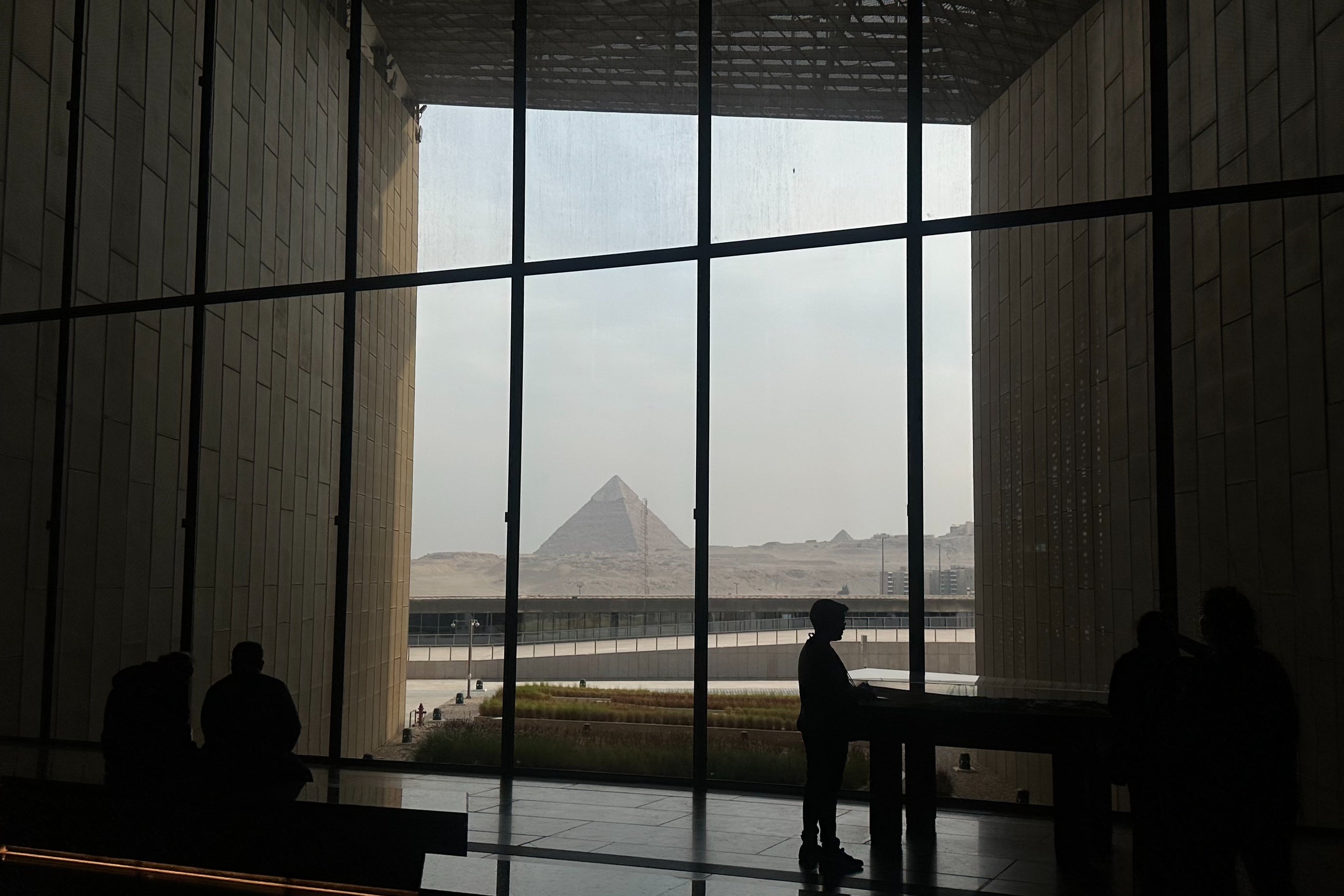 The Grand Egyptian Museum is framed by the Great Pyramids of Giza