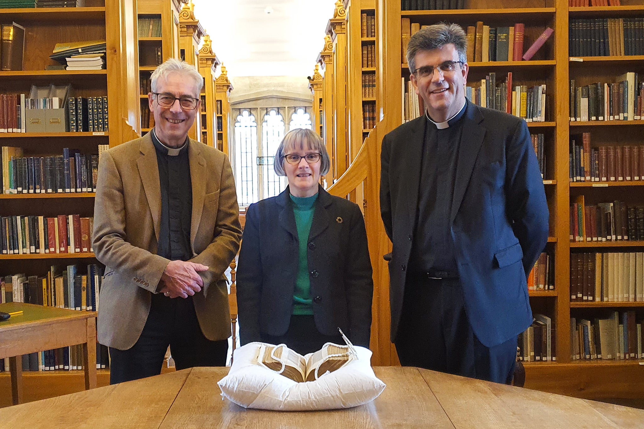 Left to right: Rev Edward Probert, Dr Anne Dutton, Cathedral Librarian and The Very Revd Nicholas Papadopulos, Dean of Salisbury, with the Bible