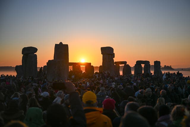 <p>Visitors watch the sunrise at Stonehenge, on June 21, 2024 in Wiltshire, England</p>