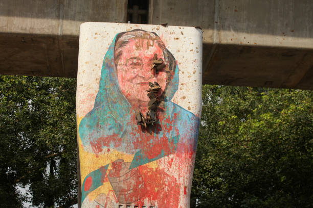 People have put garlands of shoes on Sheikh Hasina’s portrait in Dhaka in a show of disrespect