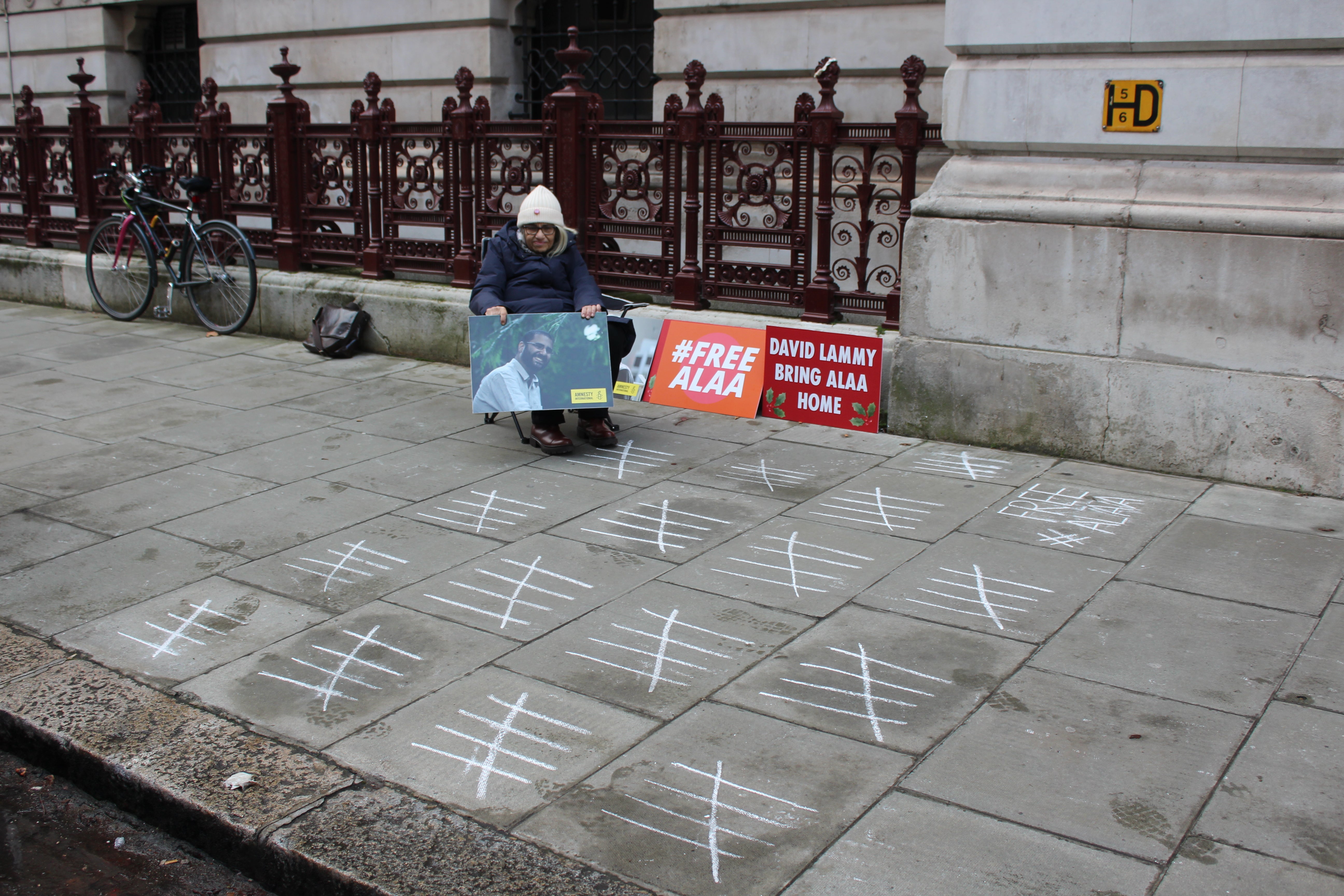 Eighty white lines have been chalked on the pavement outside the Foreign Office, one for each day Souief has been on hunger strike