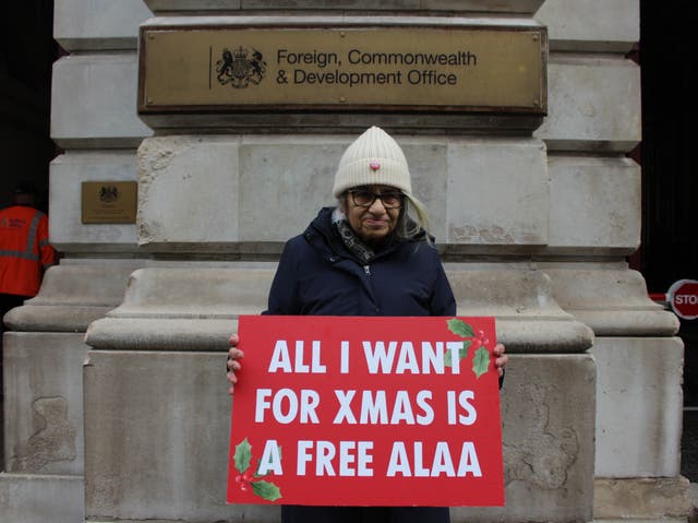 <p>Grandmother Laila Souief, 68, stands outside the Foreign Office calling for her son, Abdel Al-Fattah’s release from an Egyptian prison </p>